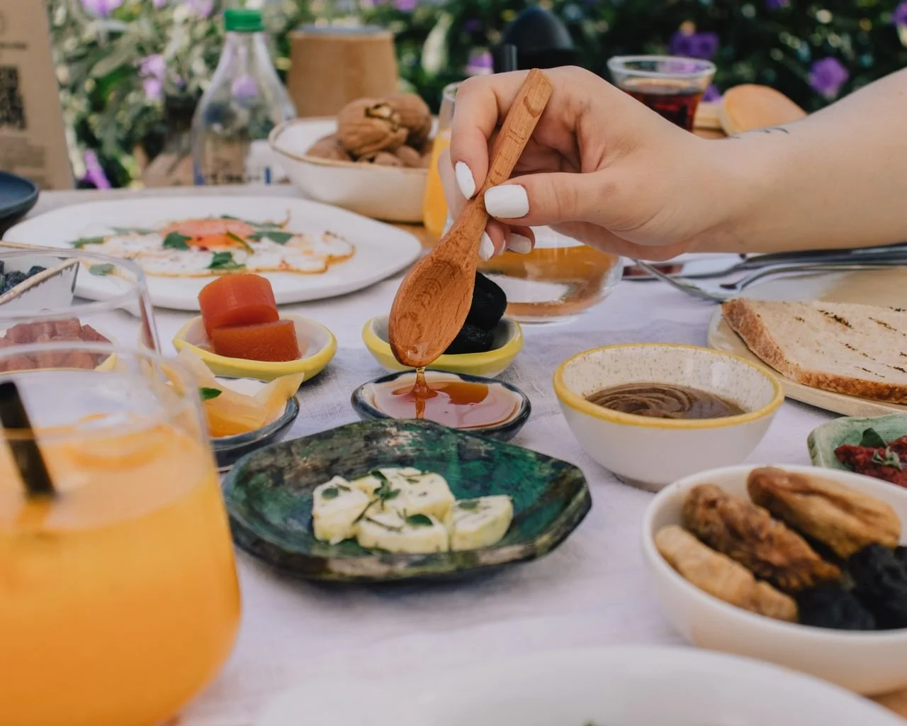 Small group garden olive oil tasting in Zadar featuring Dalmatian Underdog organic extra virgin olive oil from Nadin, paired with local bread and seasonal Dalmatian food.