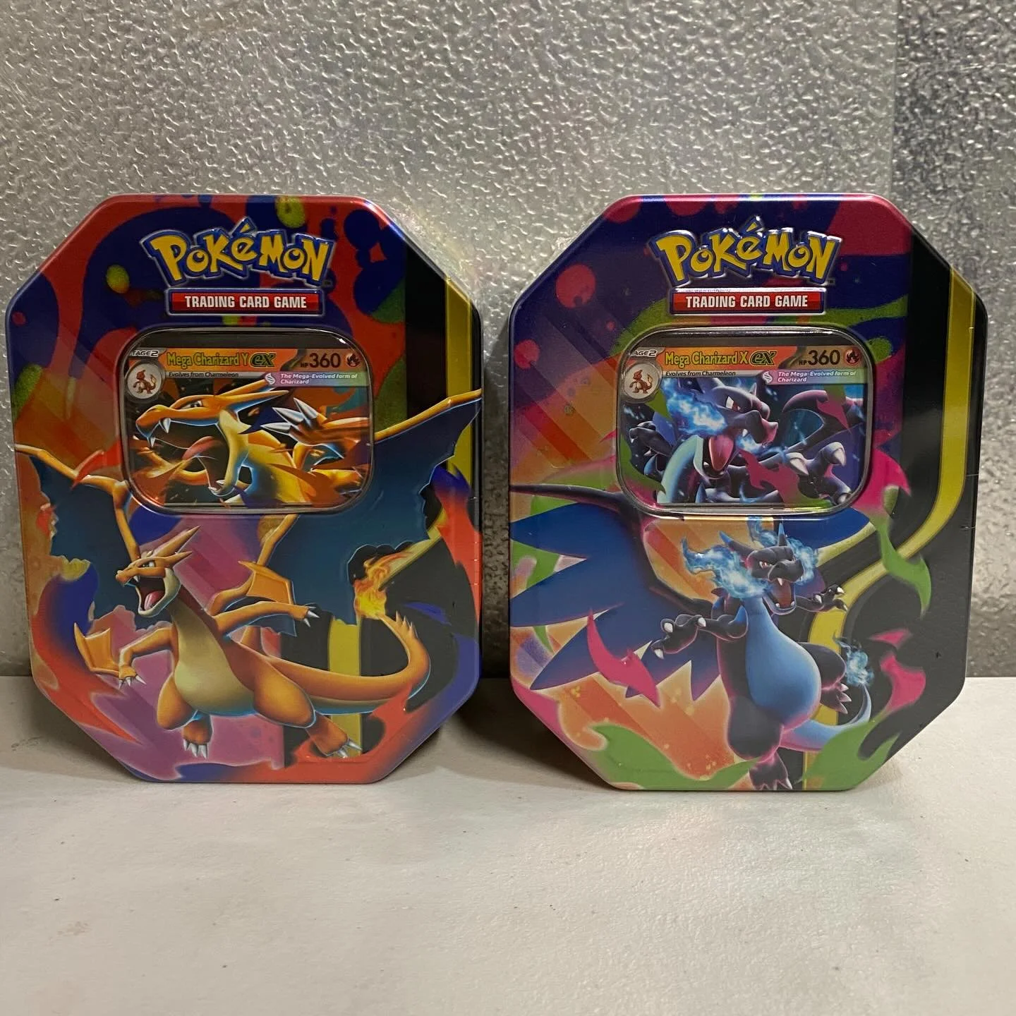 Mega charizard x and y tins now available!