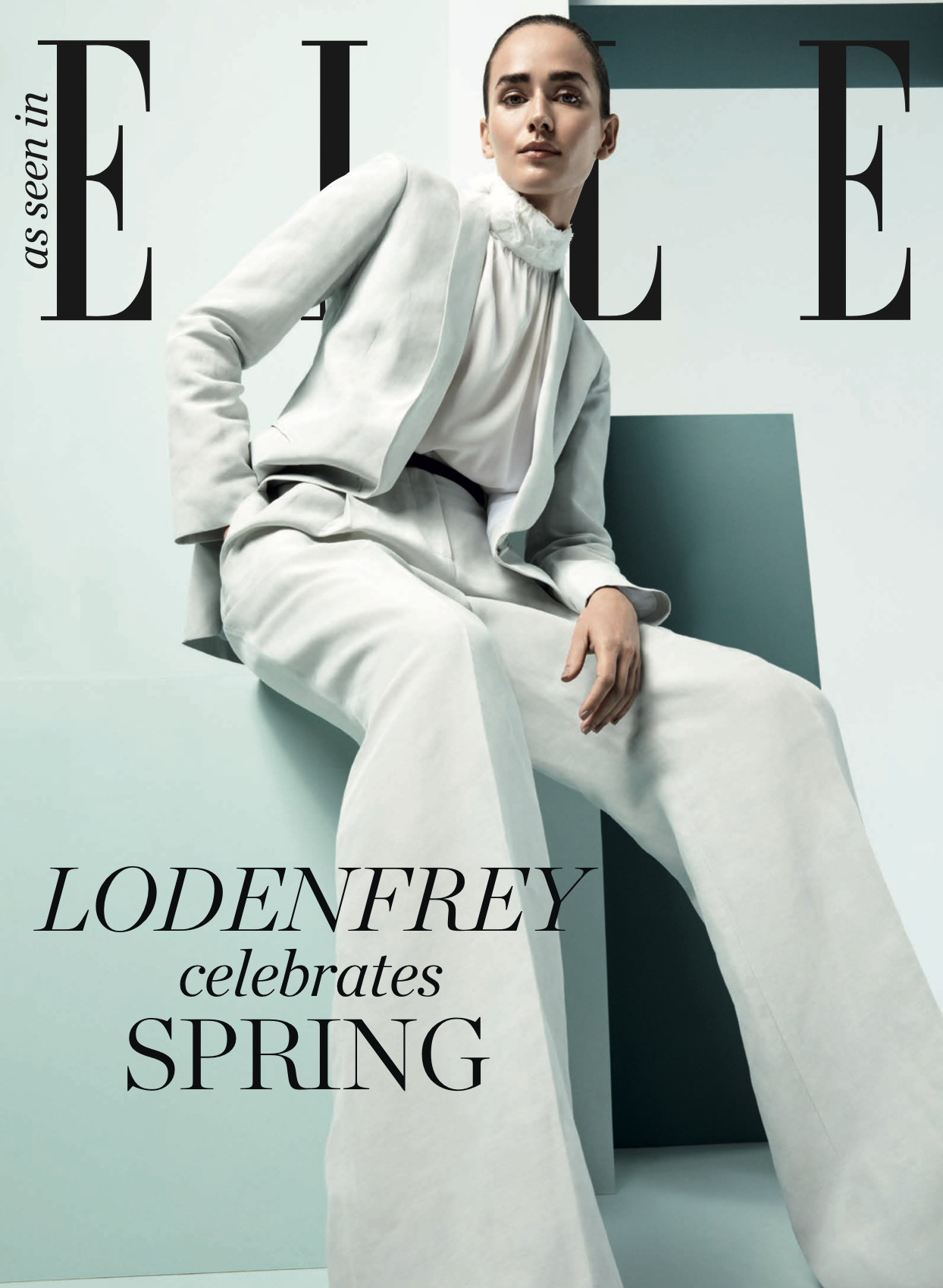 Covermotiv 2019 für Lodenfrey in ELLE: Model sitzend in weißem Anzug von Fabiana Filippi, High-End-Fashion mit unangestrengter Eleganz und „Celebrating Spring“-Mood, inszeniert von imagespy.
