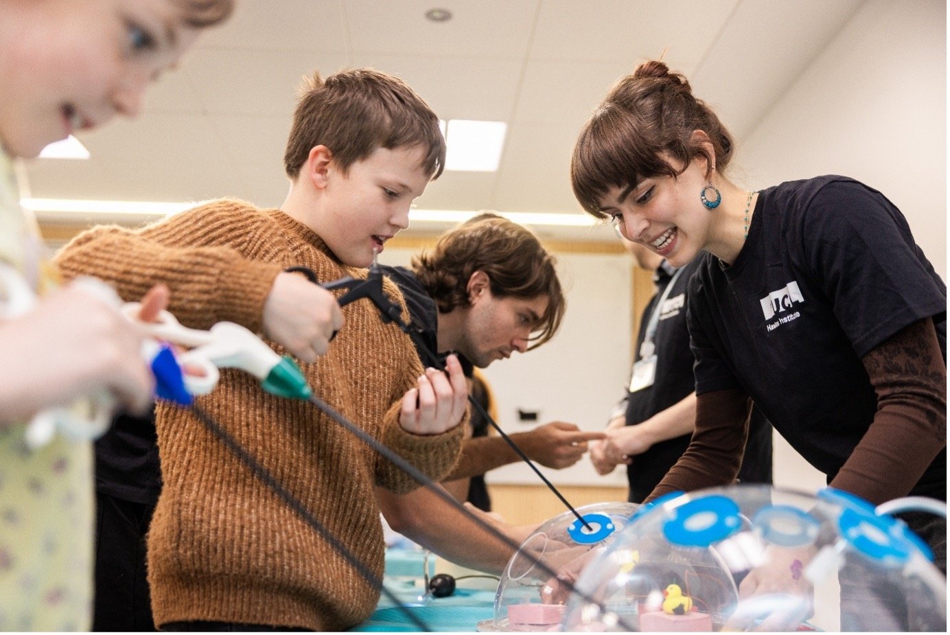 Child engaging with laparoscopic surgery activity