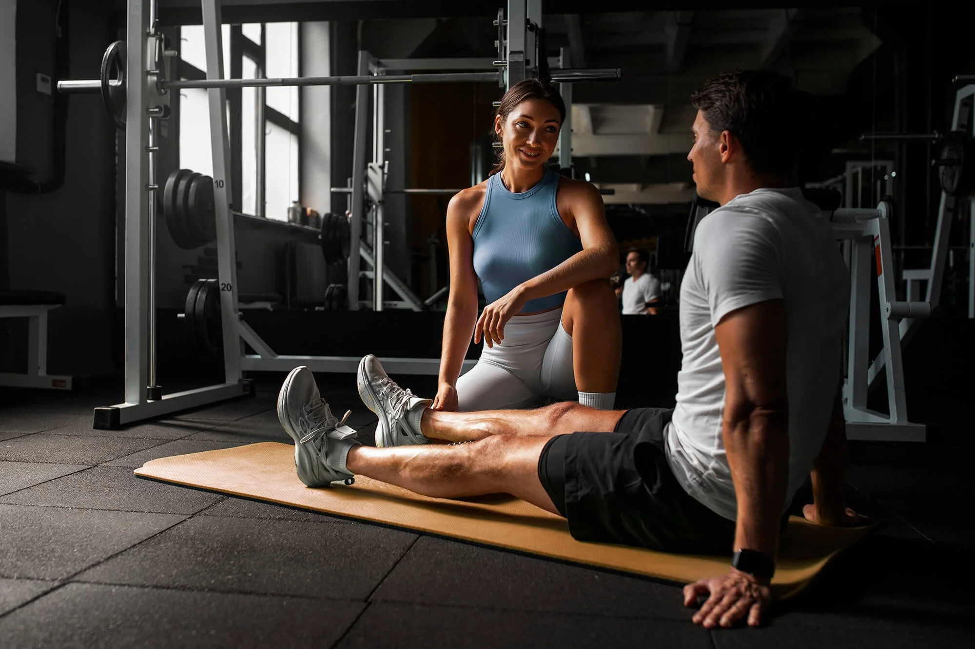 woman-helping-man-gym.jpg