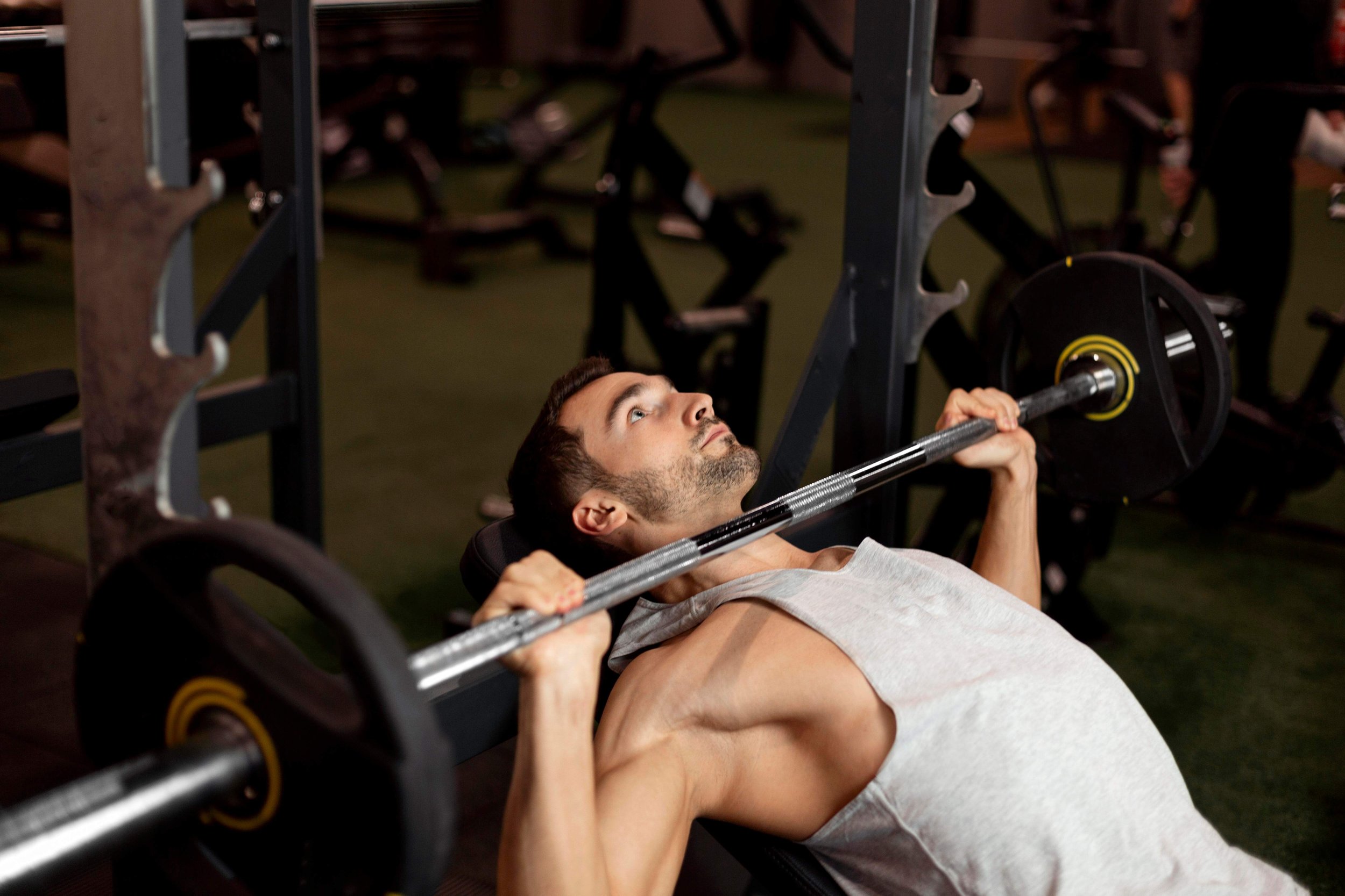medium-shot-man-lifting-bar-with-weights.jpg