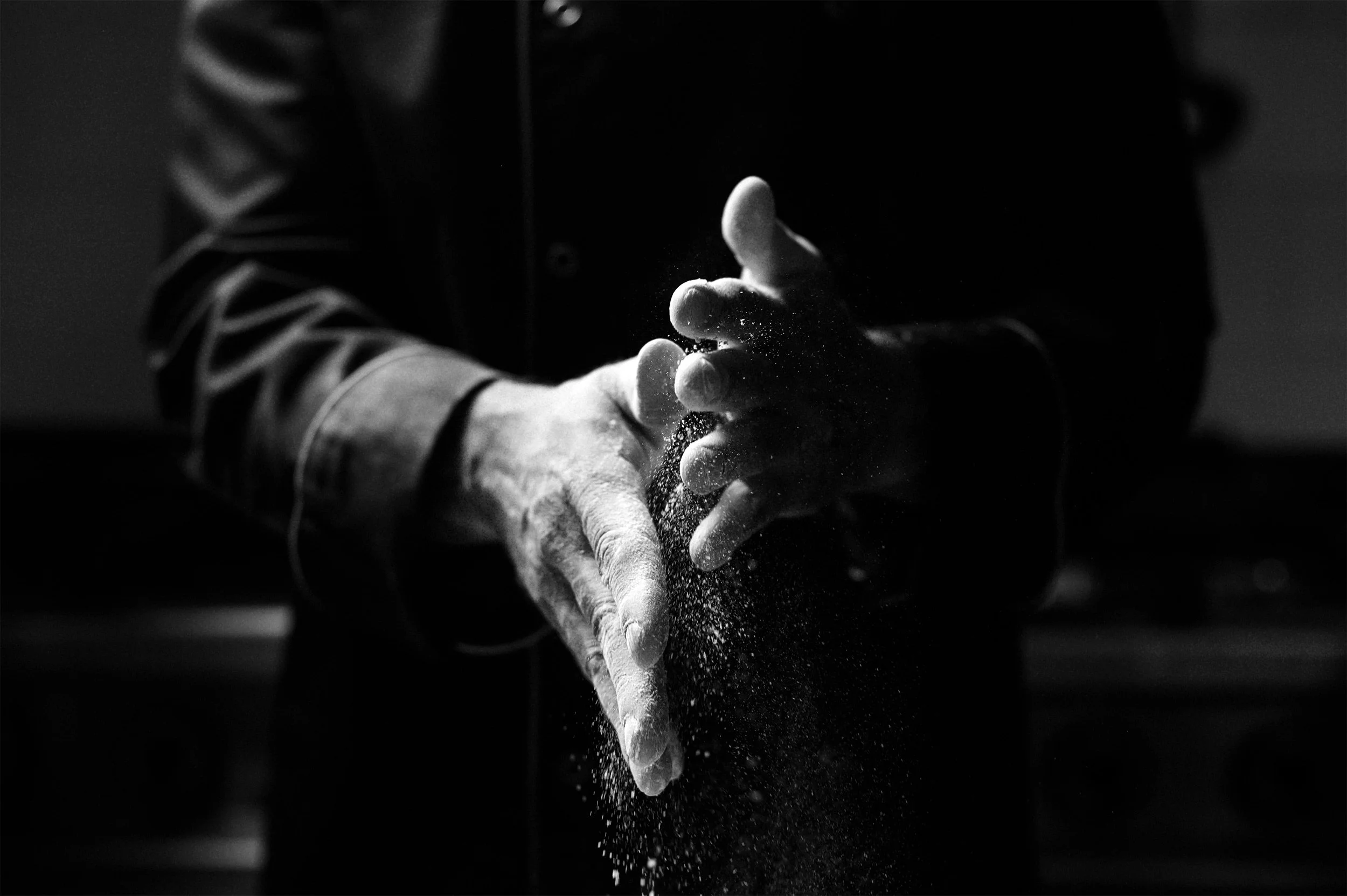 Chef’s hands preparing ingredients, representing catering consultancy expertise in foodservice operations