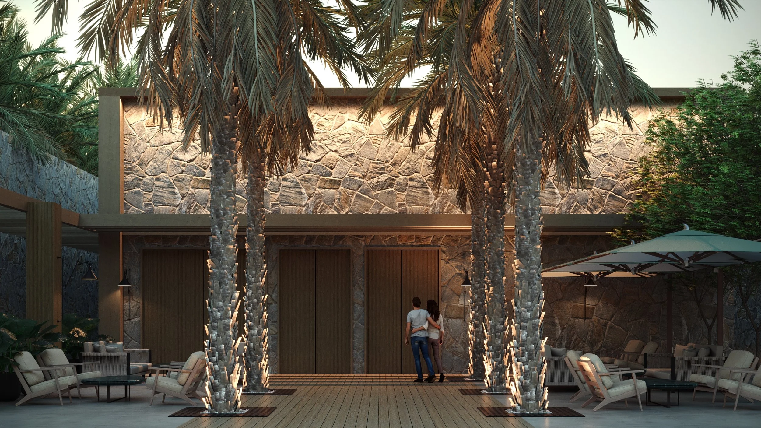 A modern outdoor patio with seating, palm trees with lights, and a stone wall background, with two people standing near the door.