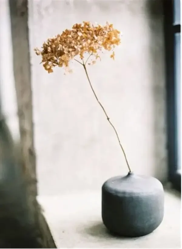 hortensia flower in a grey vase