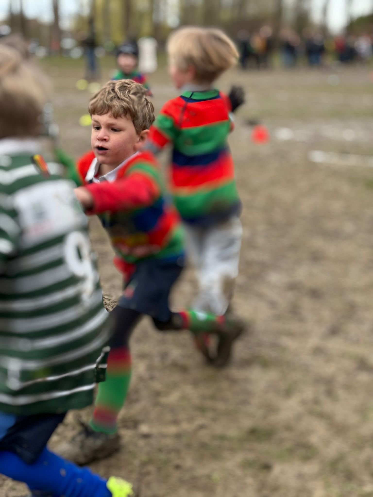 children playing rugby on a field