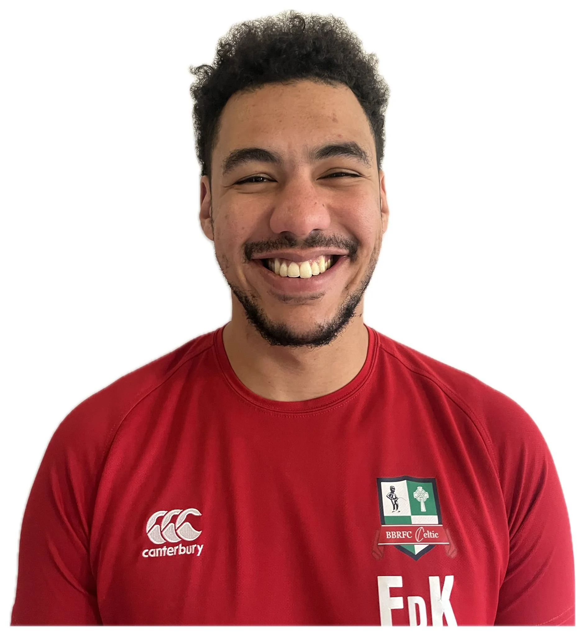 Smiling person in a red BBRFC Celtic shirt with Canterbury logo.