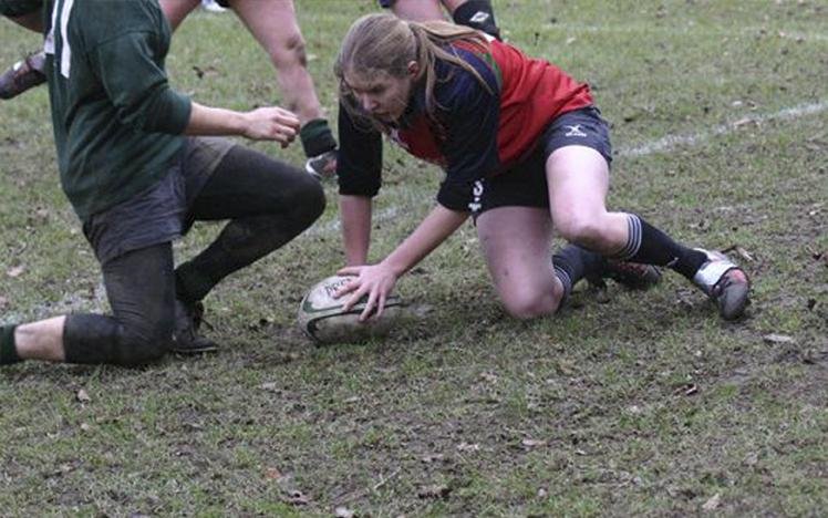 Rugby match with player in red jersey