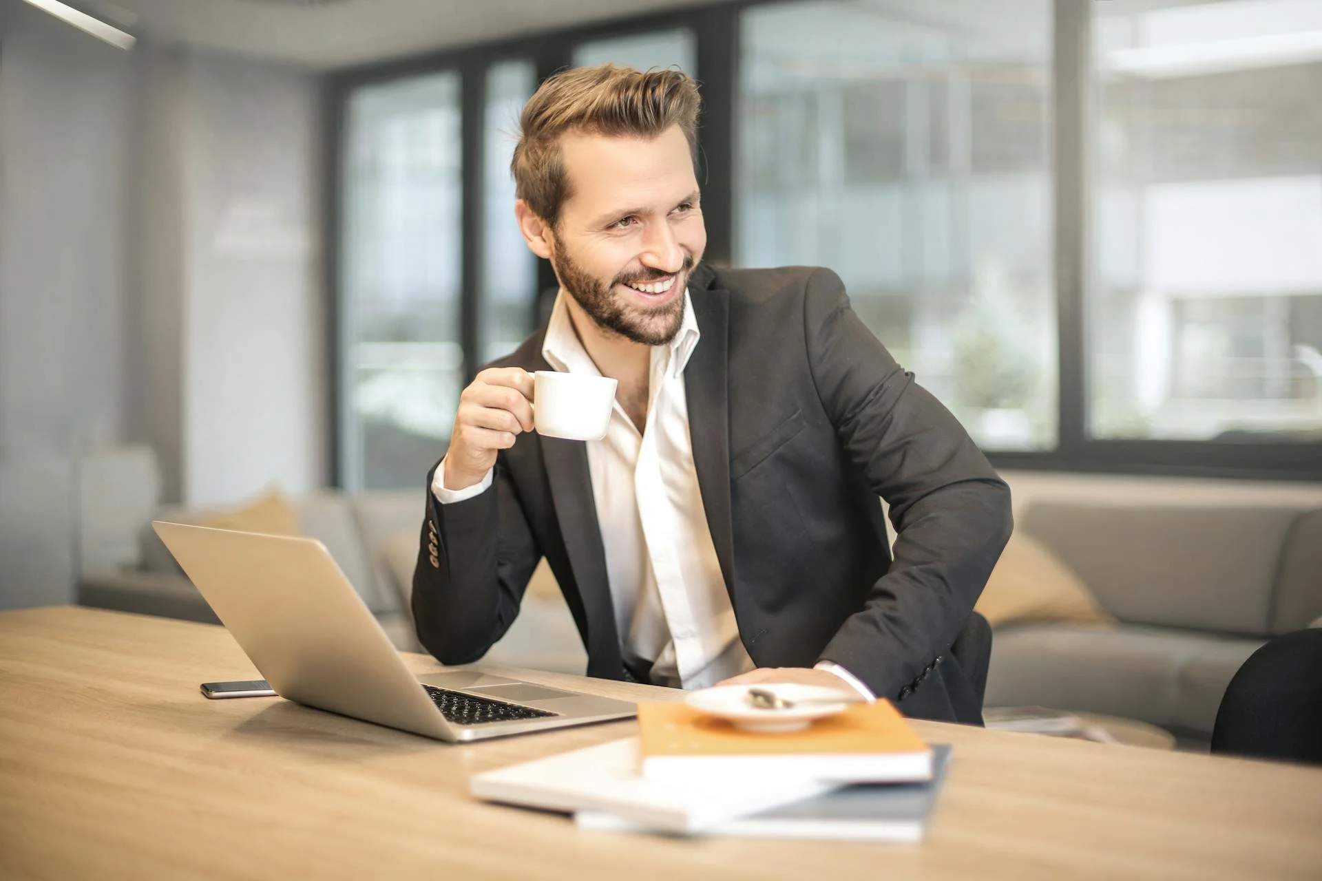 Young businessman sits at a desk in an office