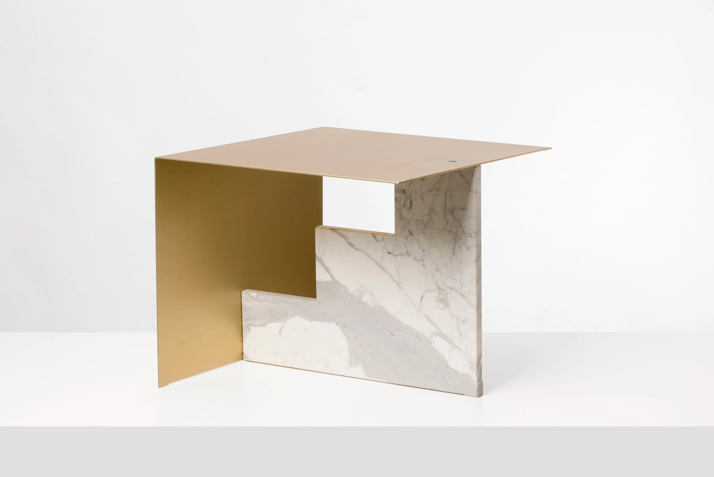 Modern geometric side table with a flat wood top, gold metal side panel, and white marble support.