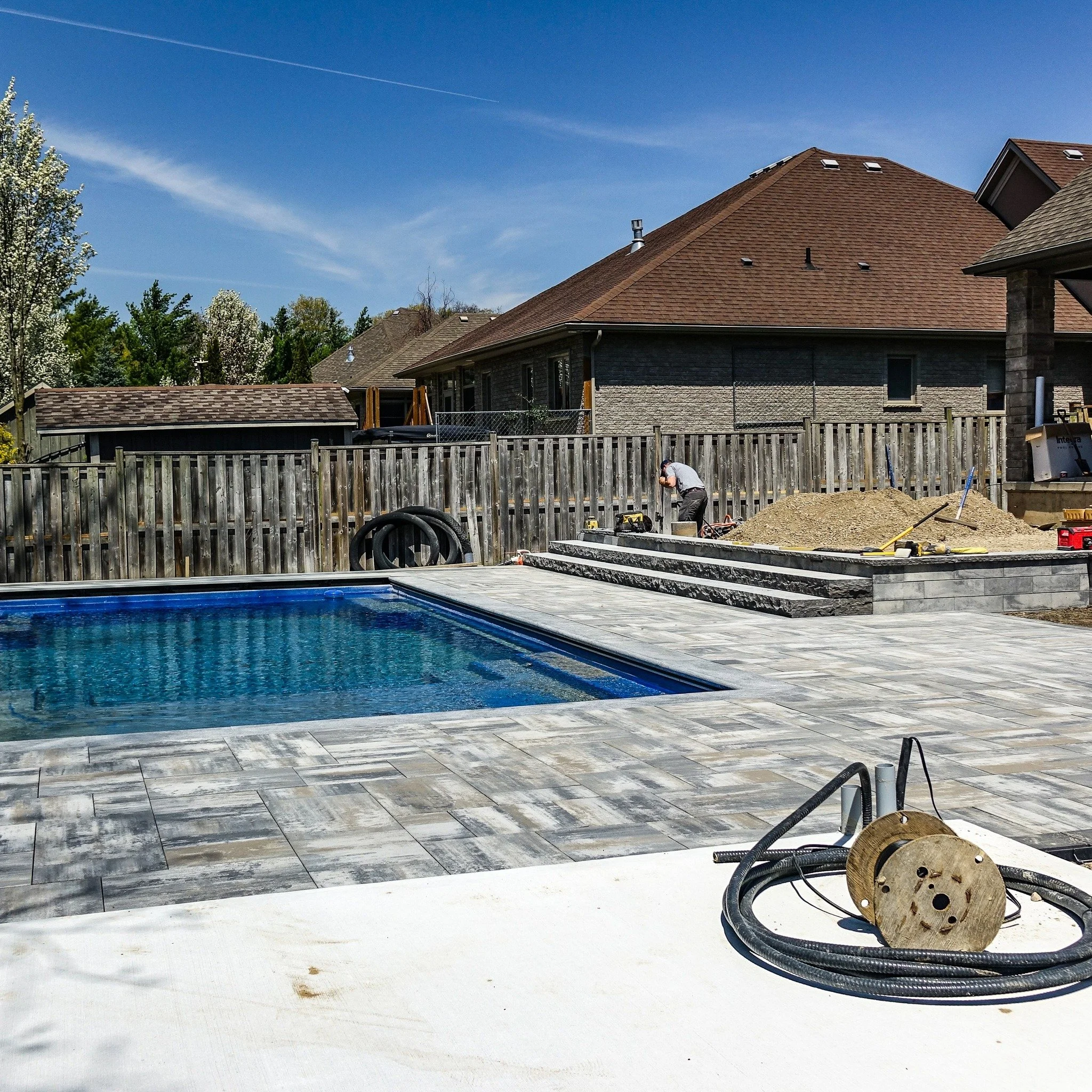 Our first pool placement of the year is coming along nicely.

The pool is in, the pavers are taking shape, and the crew has been hard at work bringing this backyard together one step at a time.

It&rsquo;s always exciting seeing a project start to co