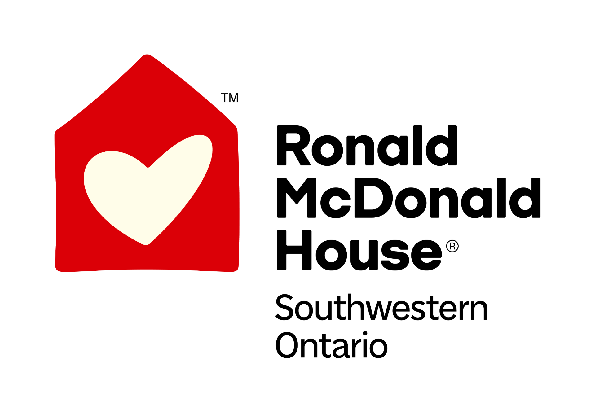 A red house with a white heart in the window and black text reading "Home is where the heart is" next to it.