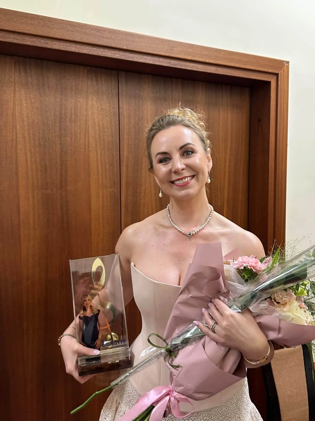 aJustina Gringytė with the Golden Disc Award