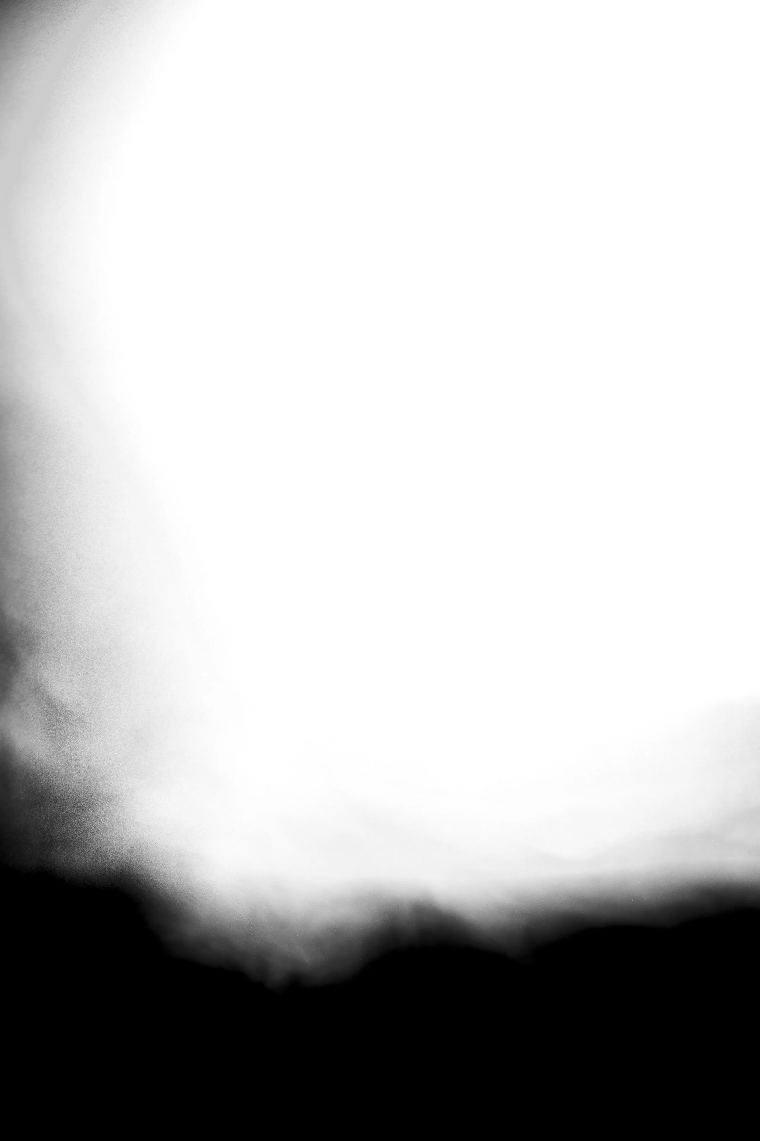 A grayscale close-up of a paper with a gradient background, darker at the edges and lighter towards the center.