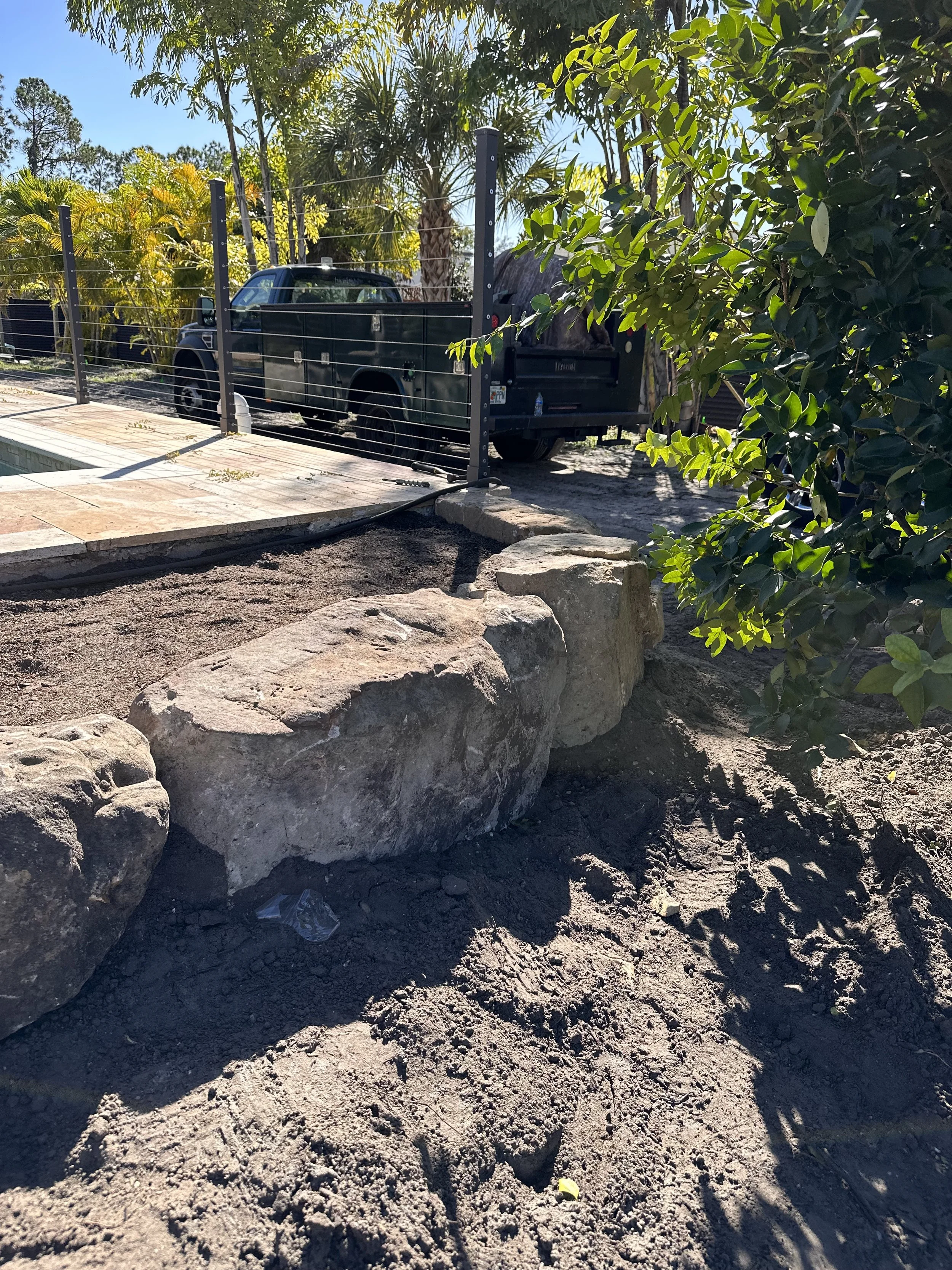 The start of the rock garden around the front of the pool.