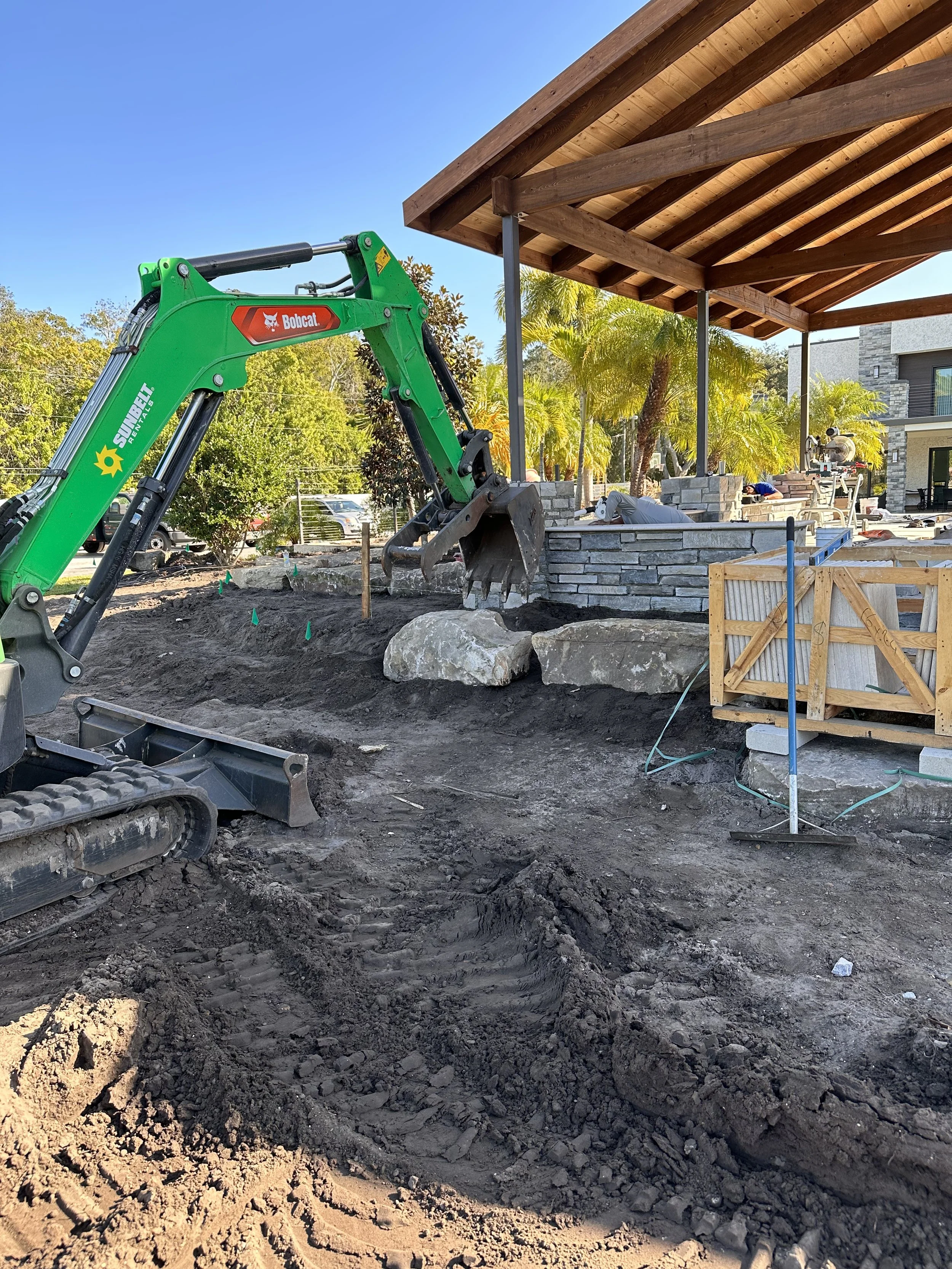 Placing the rocks on the top tier of the rock garden.