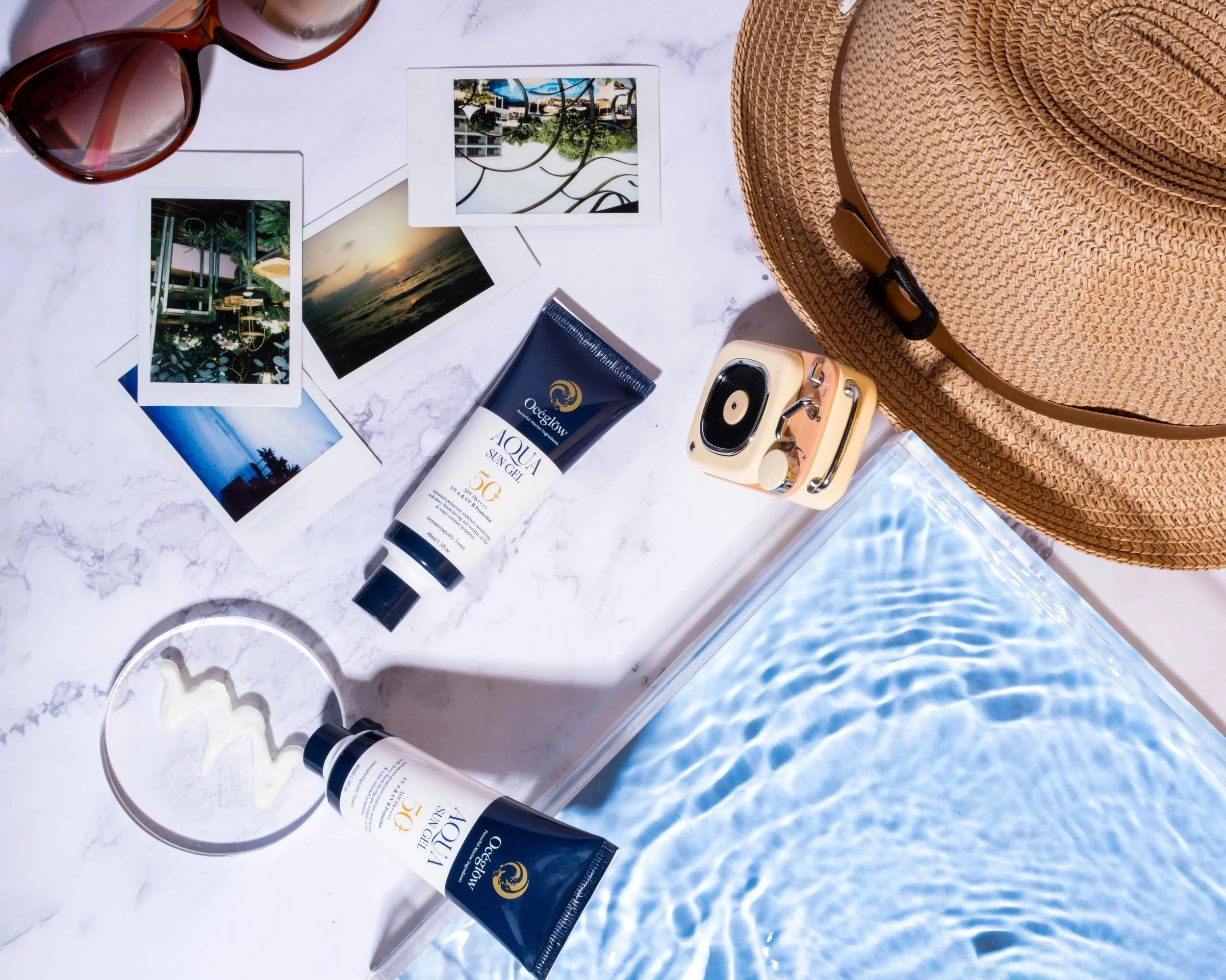 sun protection essentials for beach vacation sunscreen spf50 hat and sunglasses poolside