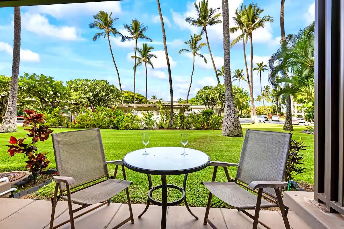 twin shore stays maui vacation rental outdoor seating area palm trees guest experience