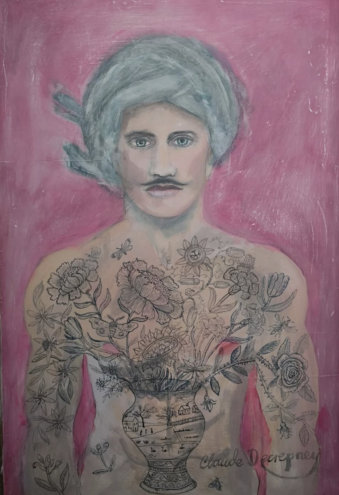A portrait of a woman with blue eyes and mustache, wearing a turban, against a pink background. The woman’s upper body and arms are decorated with black line drawings of flowers, insects, and a landscape scene within a vase.