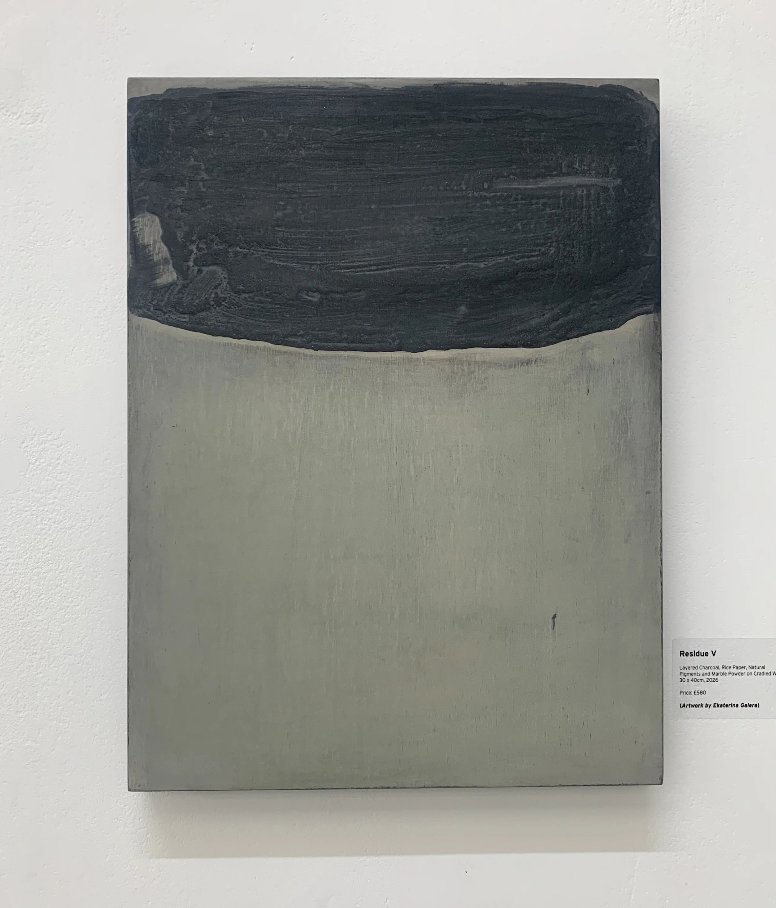 Residue V by Ekaterina Galera, charcoal and natural pigment on wood panel, exhibited in London, 2026.