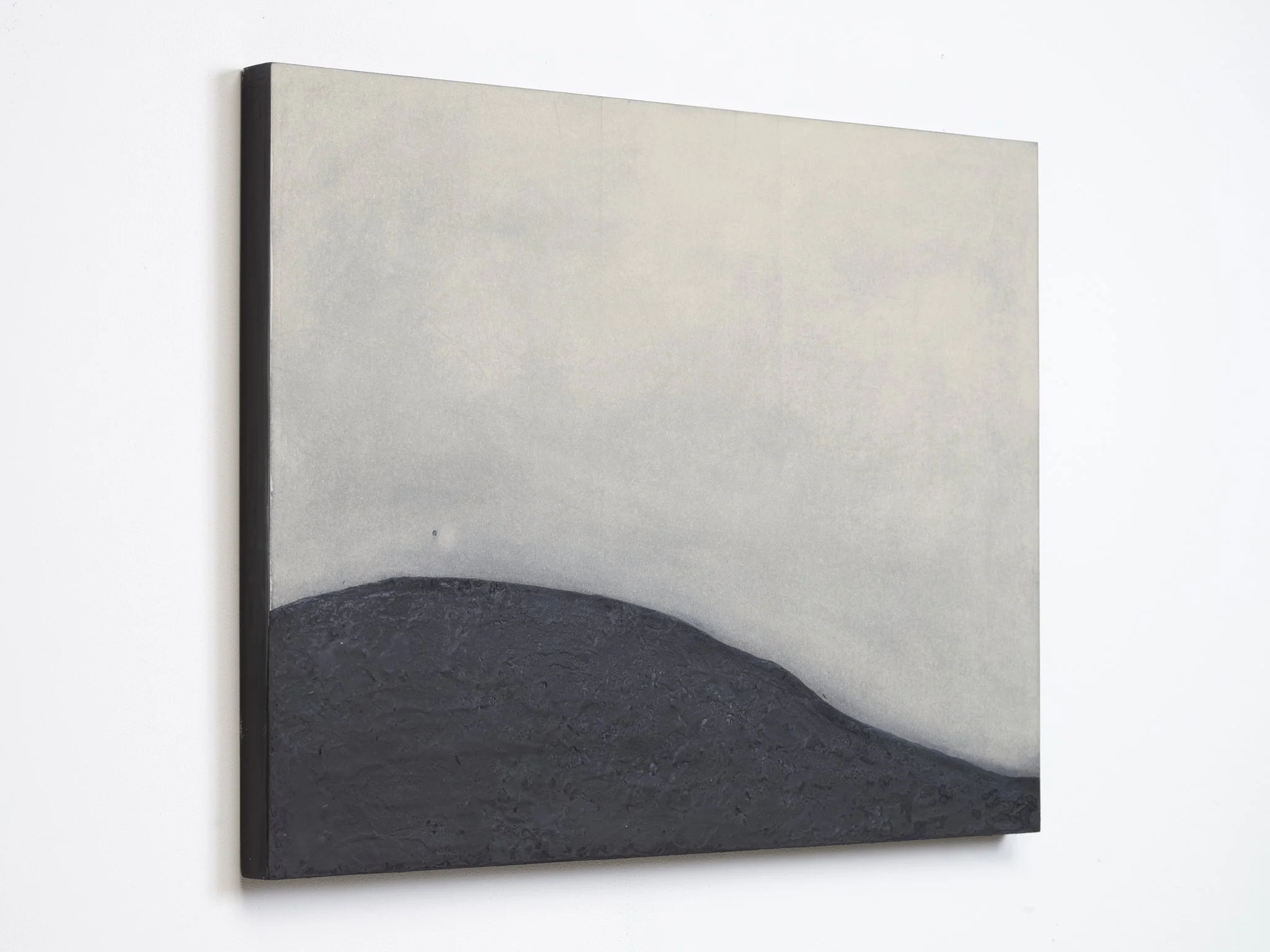 Minimalist abstract painting by Ekaterina Galera, combining charcoal and mineral textures with a neutral palette, organic forms and a strong focus on material and space.