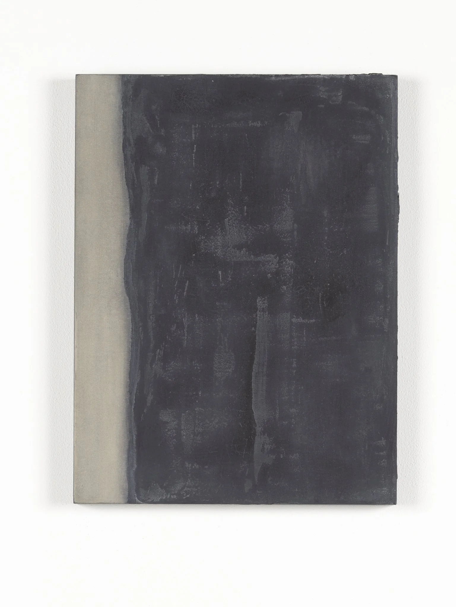 Minimalist artwork with a black textured rectangle on the right and a plain light background on the left.