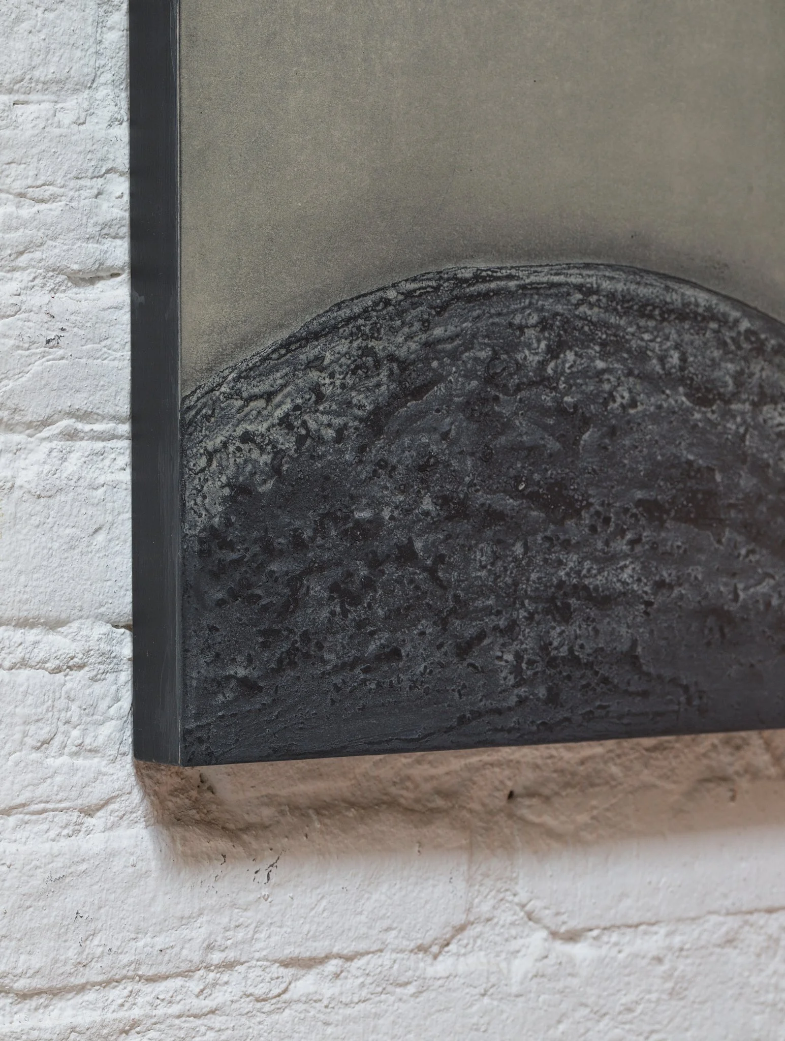 Detail of an abstract mixed-media artwork by Ekaterina Galera, showing layered charcoal, natural pigment and marble powder on wood panel.