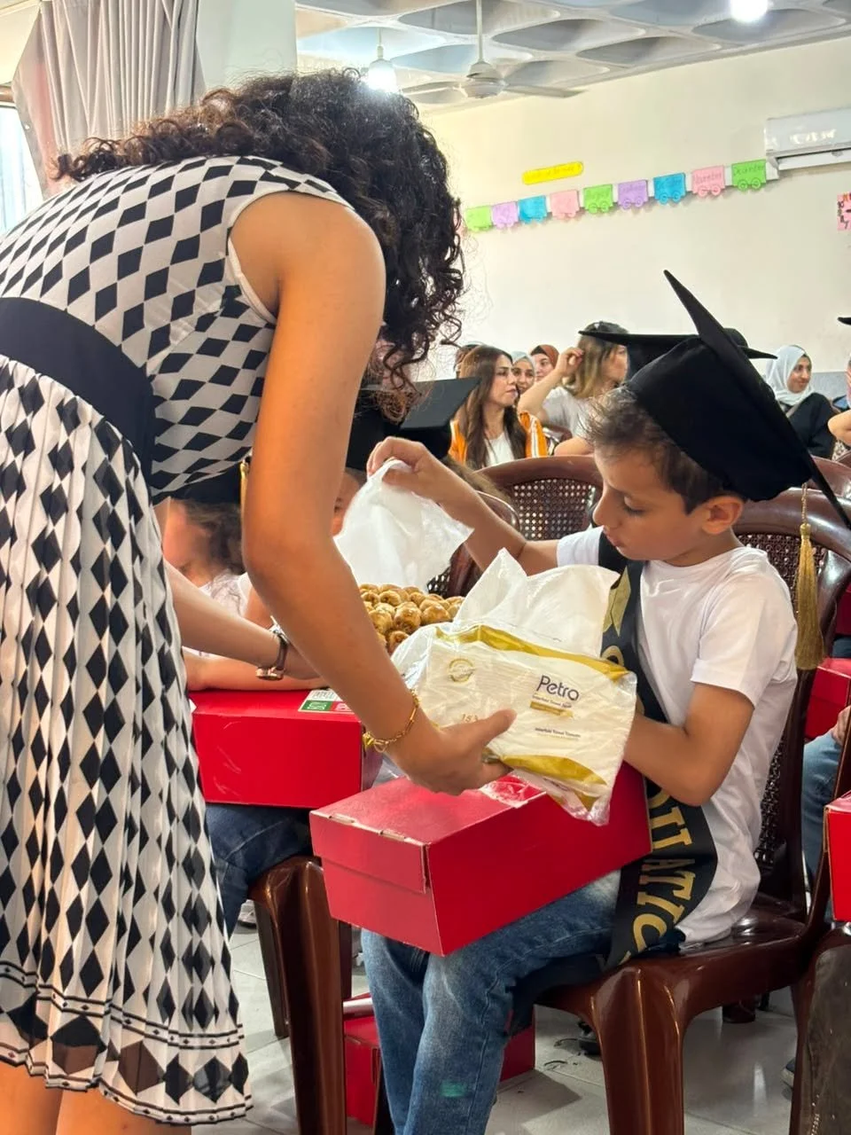 Certificates and gifts distributed at the graduation gala at Noor Academy!  Thank YOU for making this happen for our students.  Nothing would be possible without your donations.  #noorelsalam #happinessisschool #educationisthekey