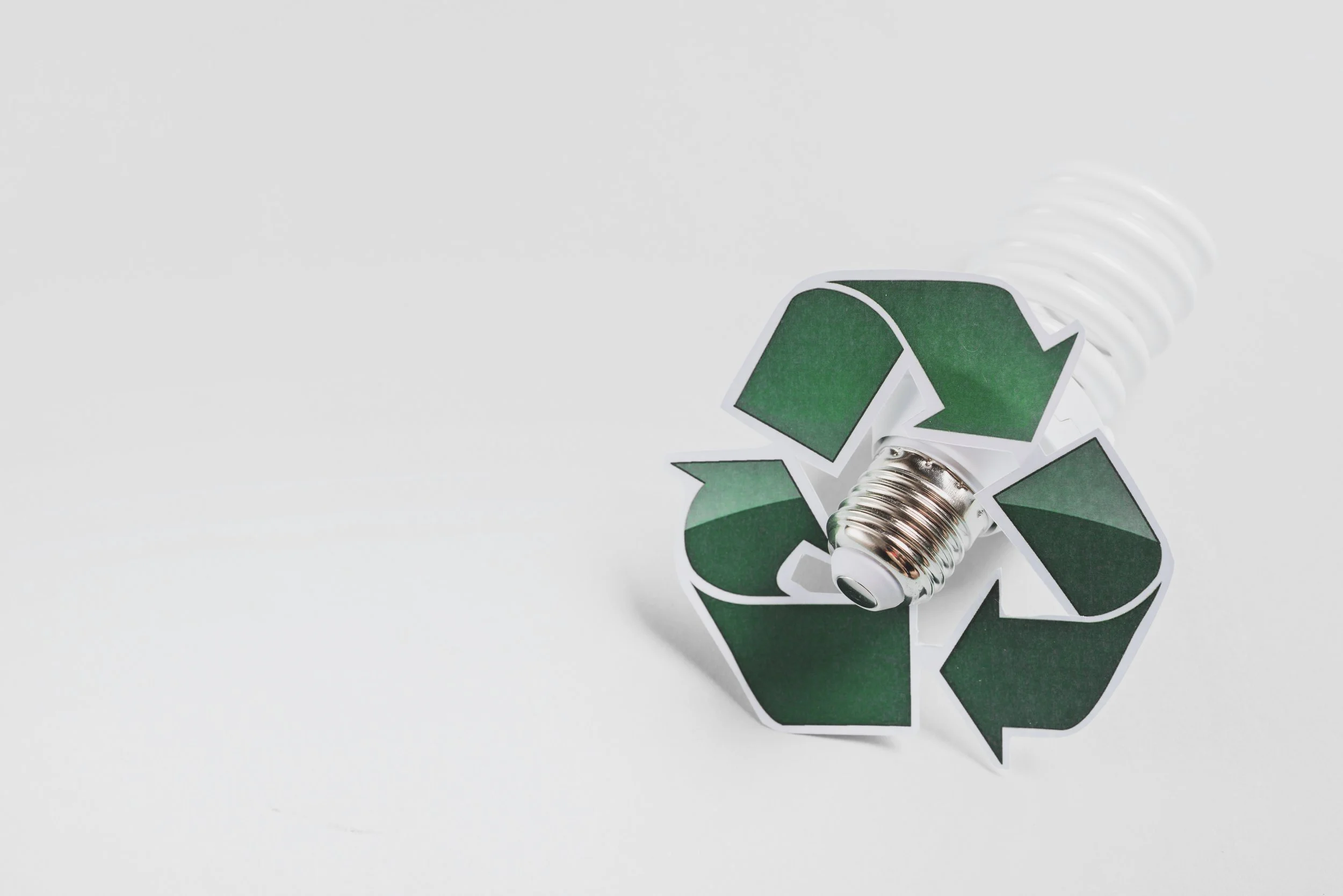 recycle-icon-compact-fluorescent-light-bulb-against-white-background.jpg