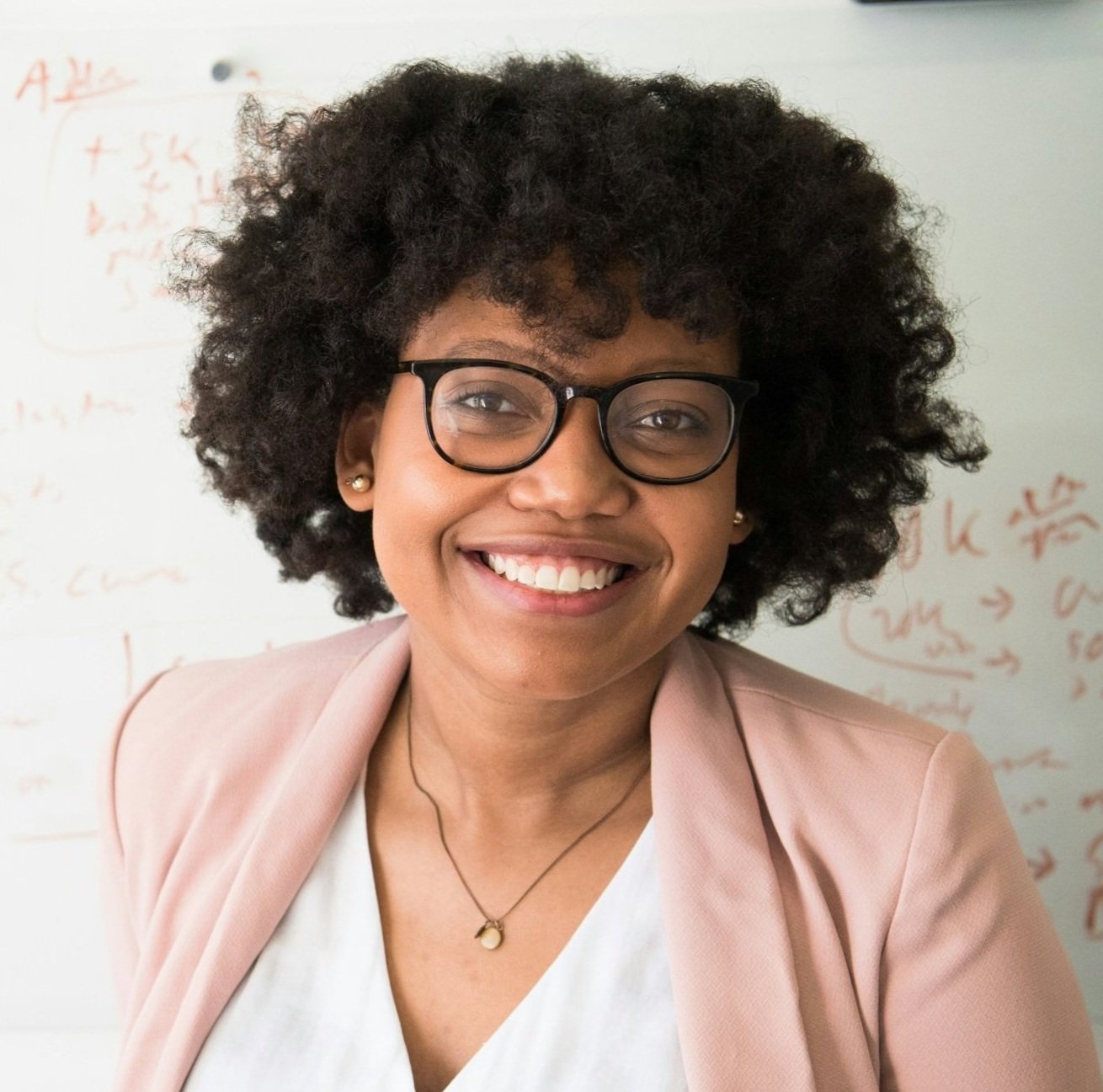 hispanic woman with red brown hair smiling