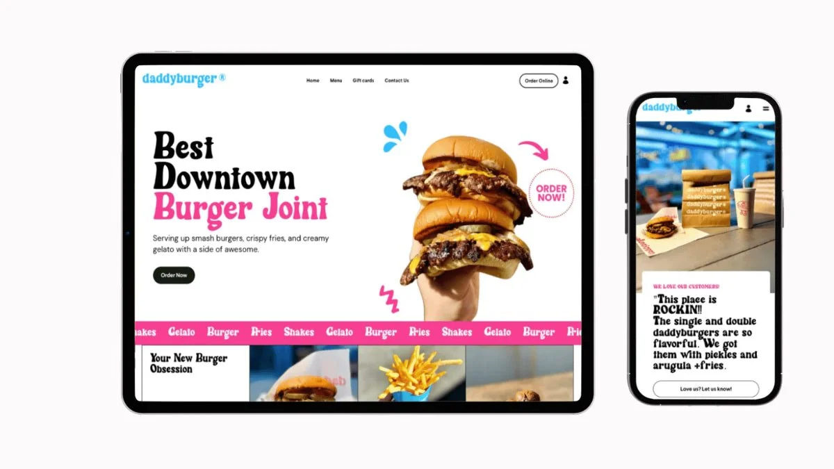A desktop and a mobile phone display a website for a burger restaurant called 'daddyburger'. The desktop screen features a large image of a hand holding three burgers, with the text 'Best Downtown Burger Joint' and an order button. The navigation bar includes links for Home, Menu, Gift cards, and Contact Us. The mobile screen shows a different section of the website with customer reviews and images of burgers and fries.