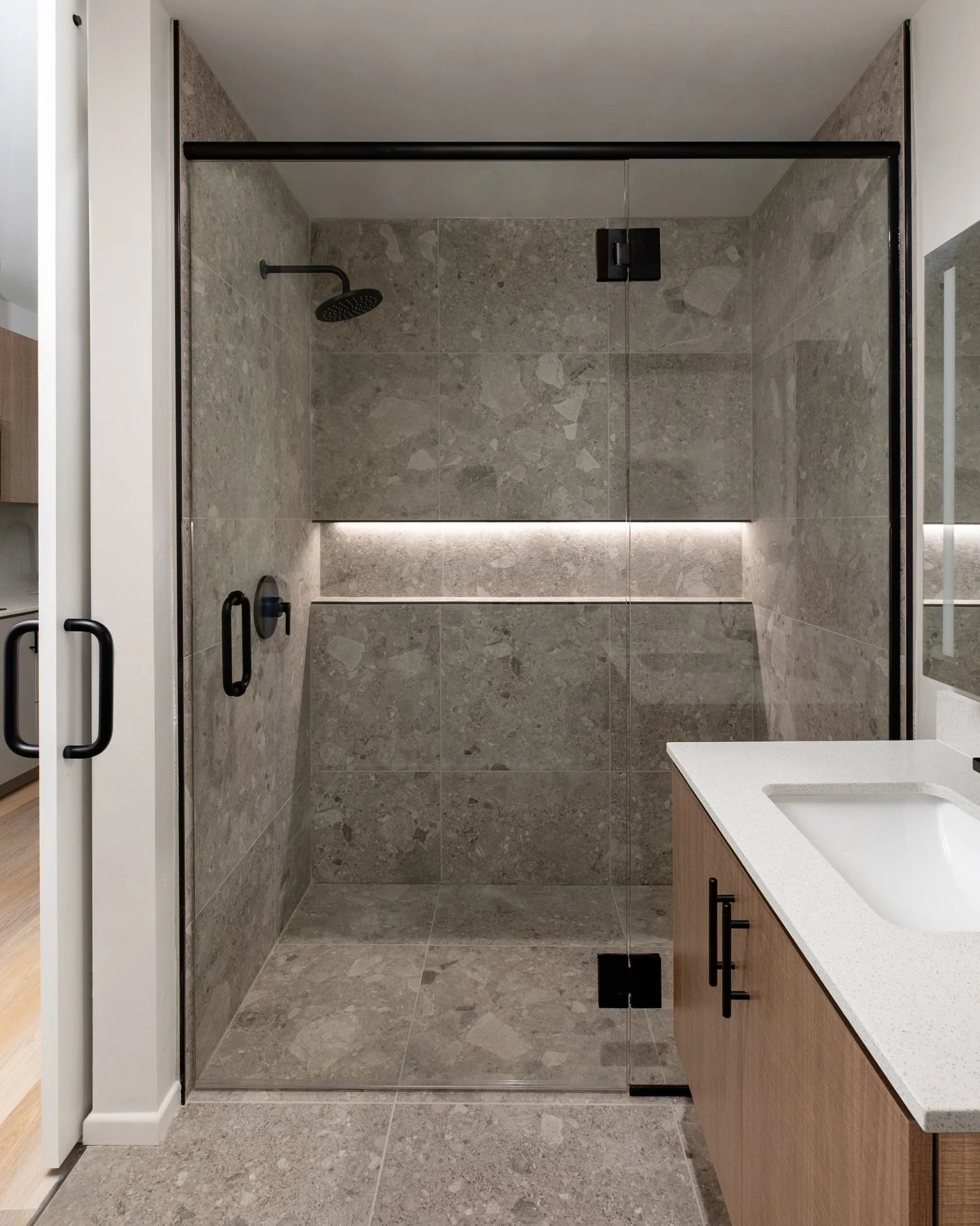 Bathrooms in multifamily projects tend to sit in that sweet spot - clean, minimal, and built to last, but still warm enough to feel like home.

It&rsquo;s a balance we keep coming back to: simple lines, durable materials, and just enough texture or t
