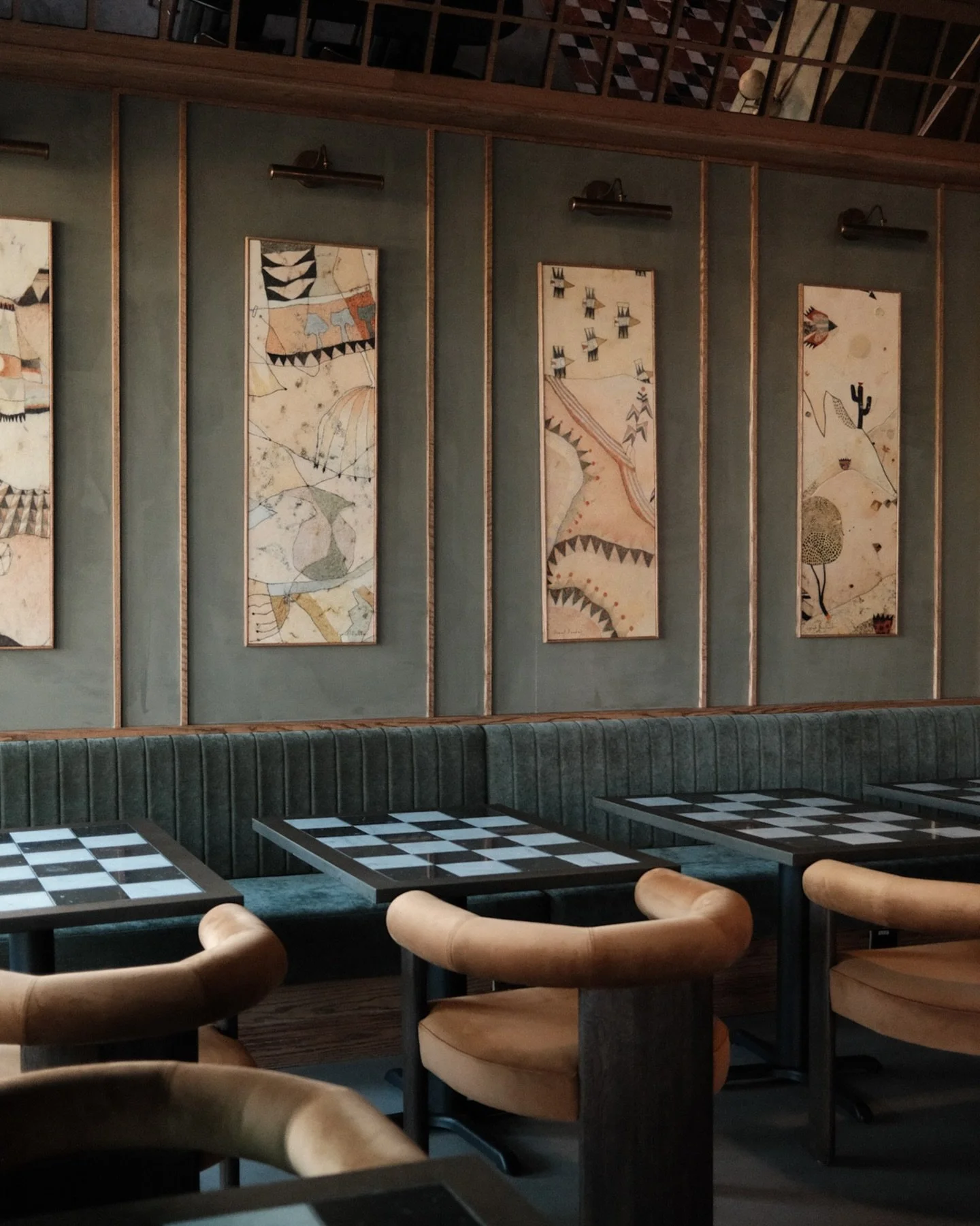 Custom tables for @basepaircafe_3020 

What started as a simple idea&mdash;a black and white checker tile tabletop&mdash; required a precise approach to get it right.

We CNC-routed the @richlite surface to receive each tile, allowing the pattern to 