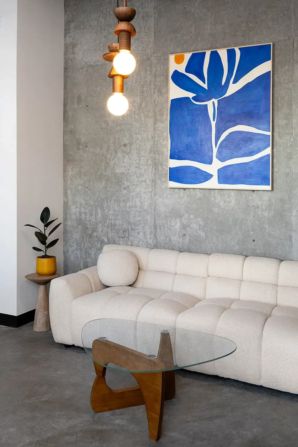 8th-and-u-living-room-blue-artwork-boucle-sofa.webp