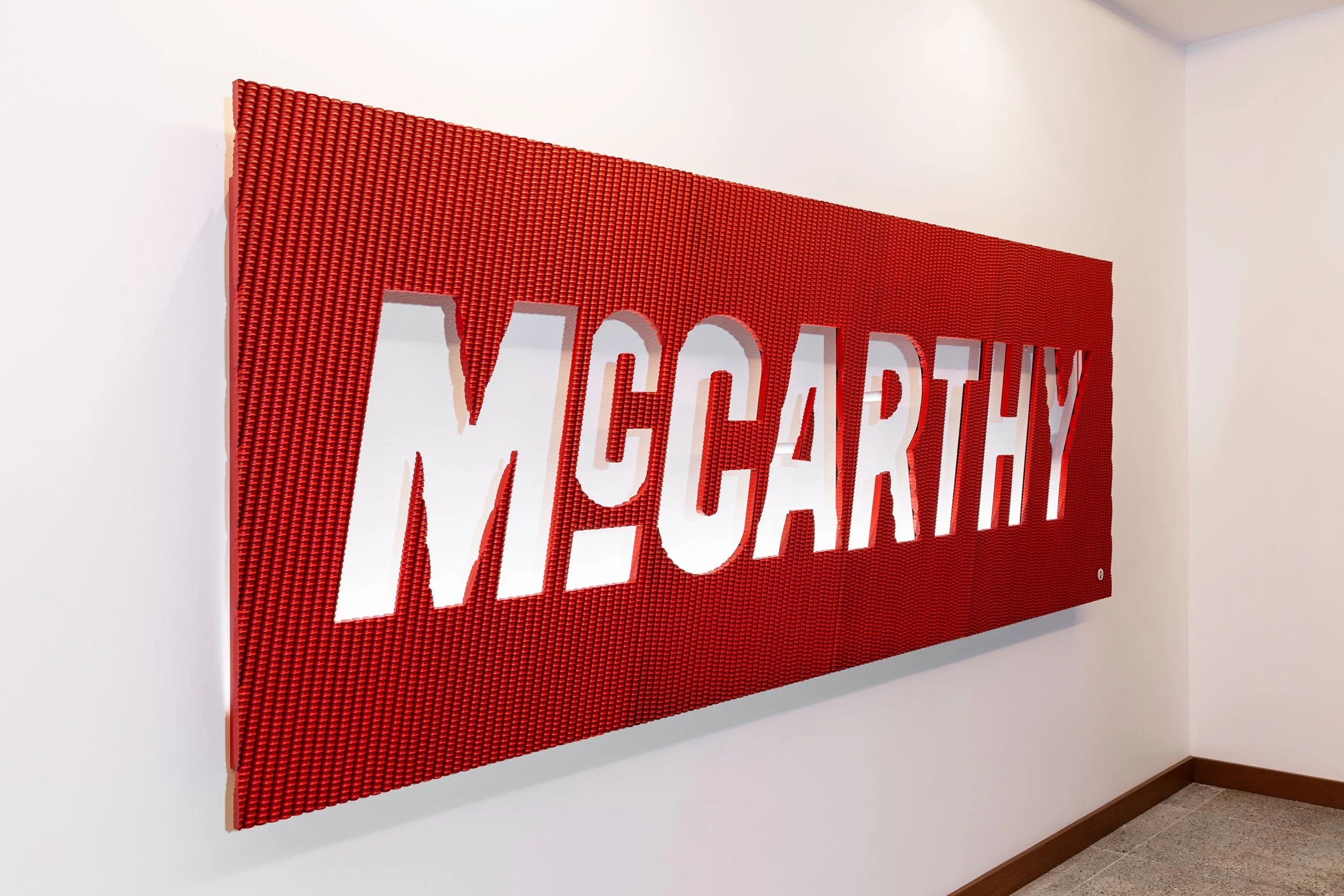 McCarthy's custom signage made from metal rods powder coated red.