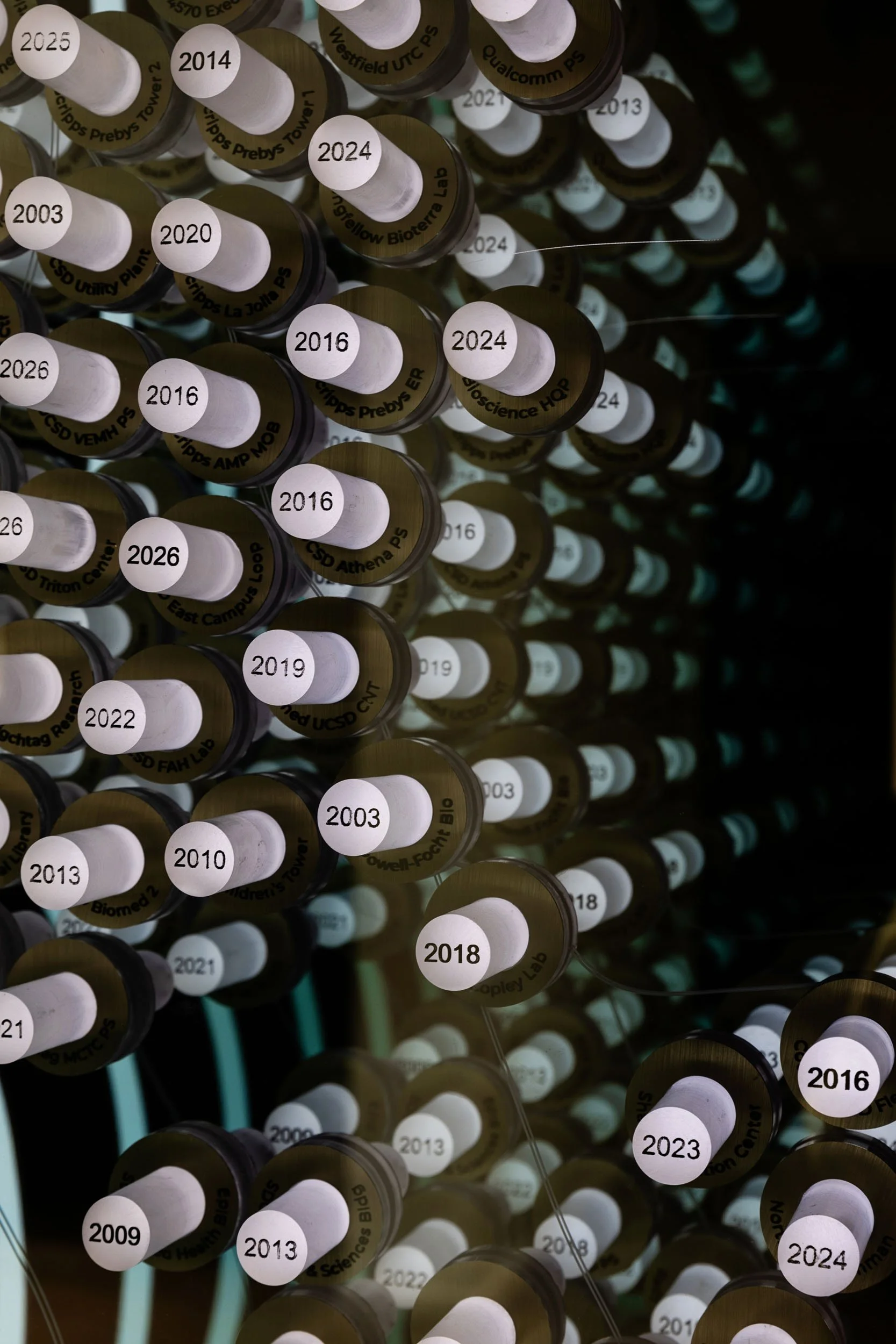 Close-up of circular elements arranged on the custom infinity mirror  at the McCarthy office in San Diego.