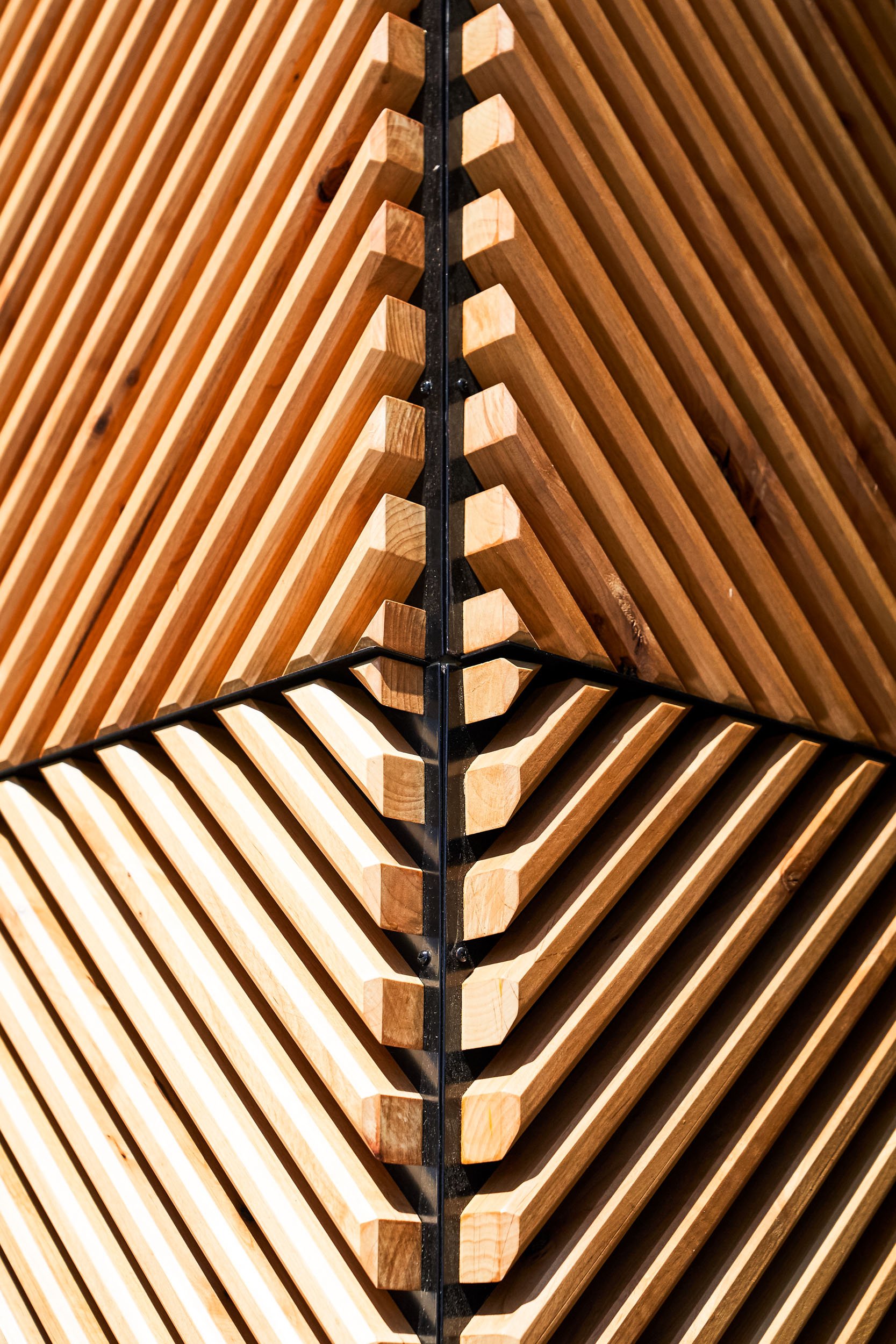 close-up of angled wood elements forming a distinctive architectural detail at Nolita Hall.