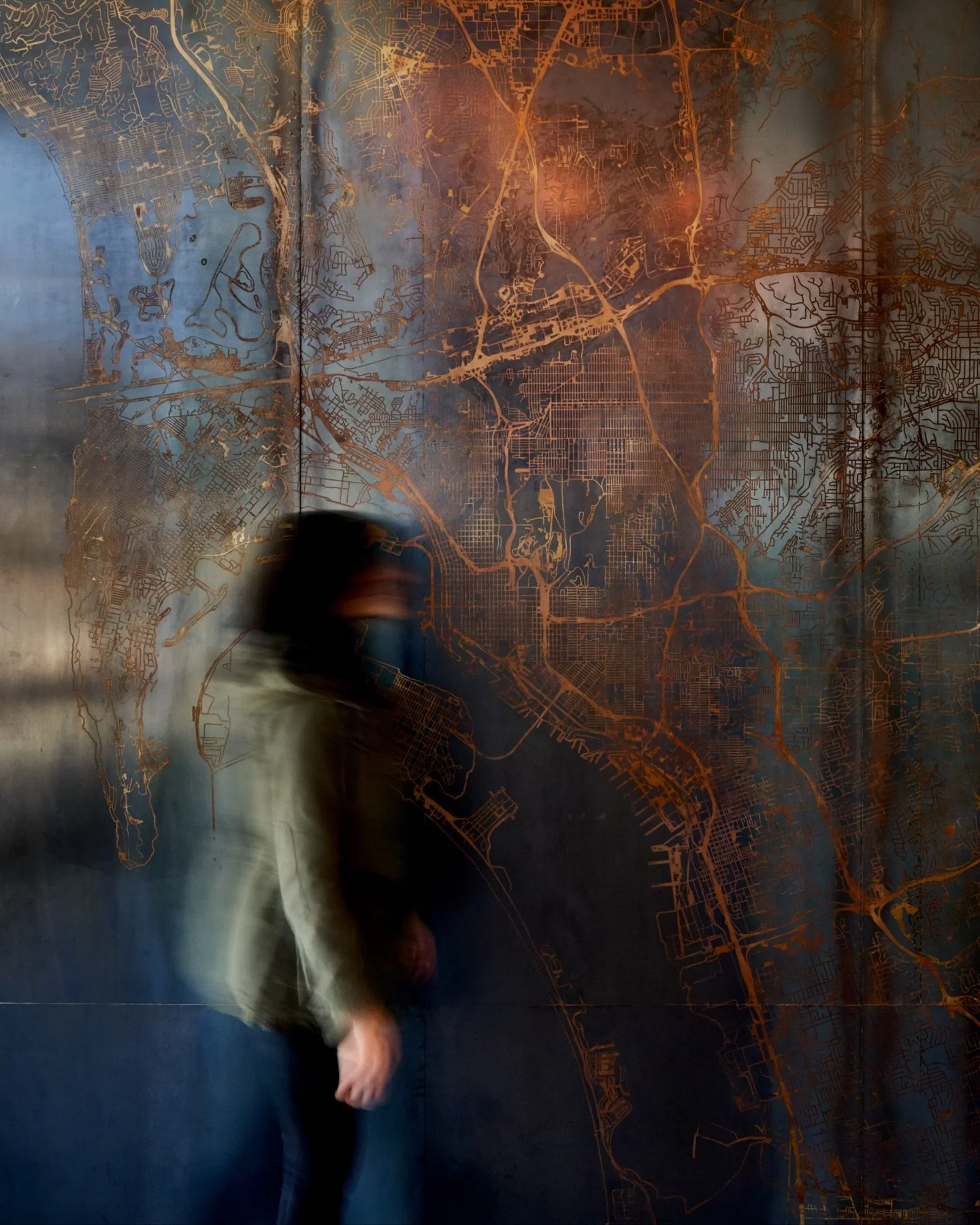 Custom steel wall for CBRE.

We turned a plain elevator wall into a standout feature with a custom acid-etched steel design. 
The patina keeps evolving over time, revealing more of the character of the map each year-so the wall literally evolves as i