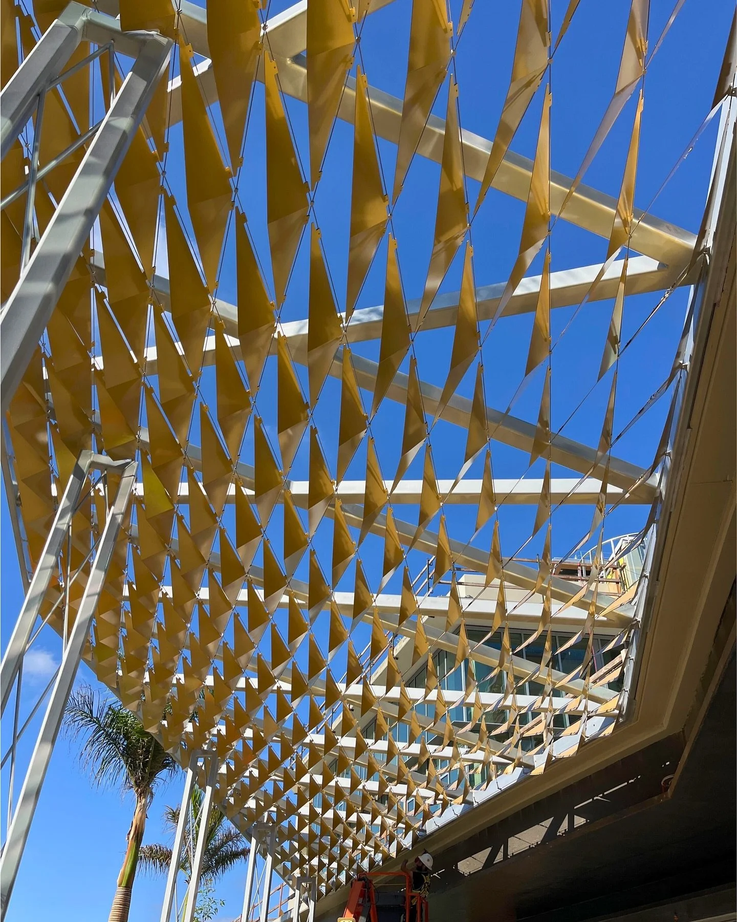 Excited to share a recent installation we completed based on a design by @safdierabines .

The project features a 16&rsquo; high shade structure spanning 94&rsquo;, composed of 324 decorative aluminum plates suspended on 35 stainless steel cables.

O