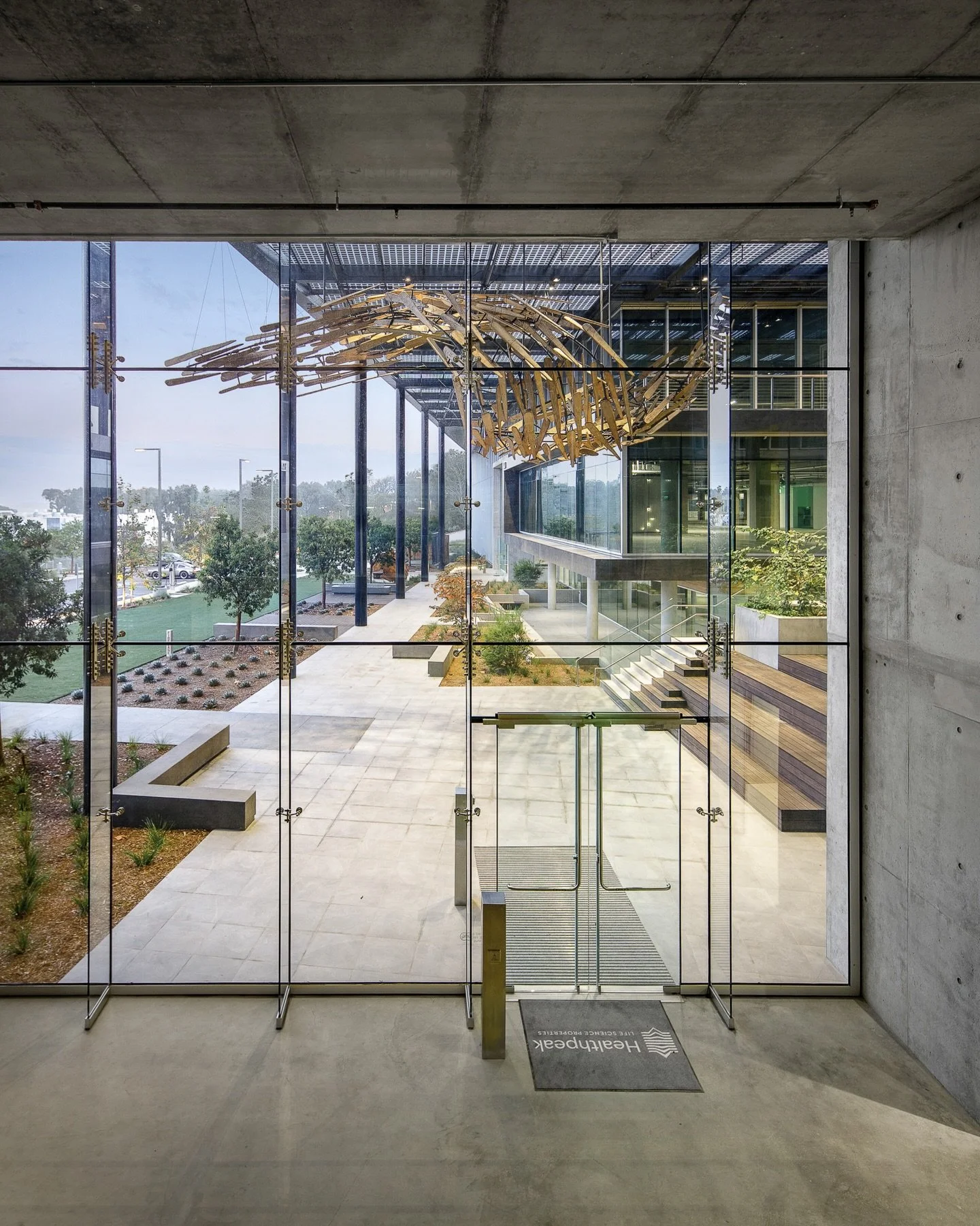 Inspired by the fluidity of nature, our team brought this Torrey Pines project to life through a sweeping 35-ft wooden spine installation and sculpted wave-form benches.

Swipe to see how these pieces came together
-from early fabrication to final in