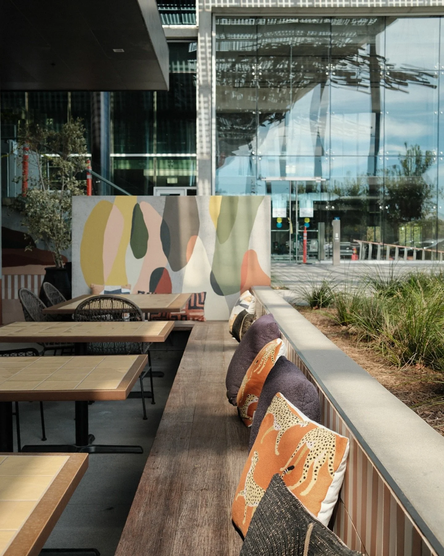 Custom mural for our latest caf&eacute; project-developed for a bioscience client and inspired by the World Caf&eacute; concept.

Painting directly on concrete always lands right. You still get the rawness of exposed concrete, but with a layer of int
