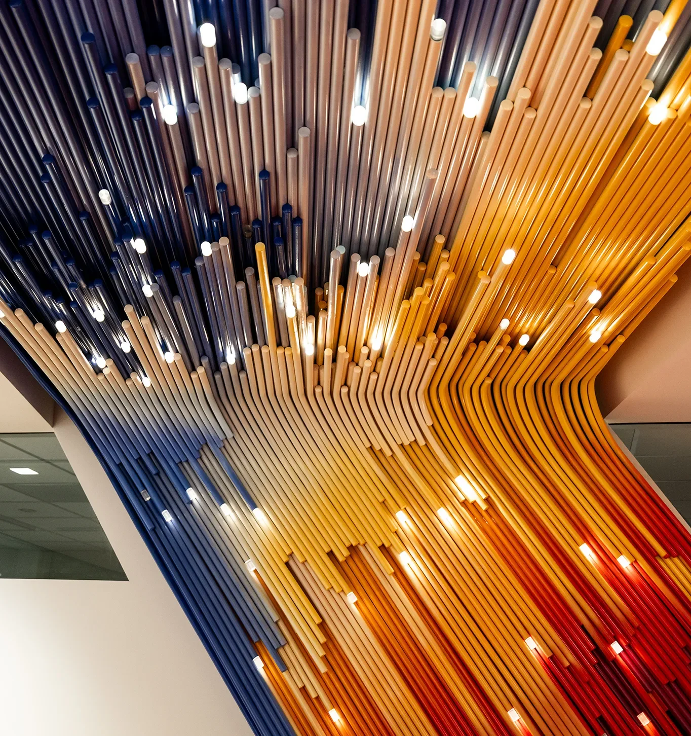 Suspended colored rod art installation at UCSD, see art installation fabrication.
