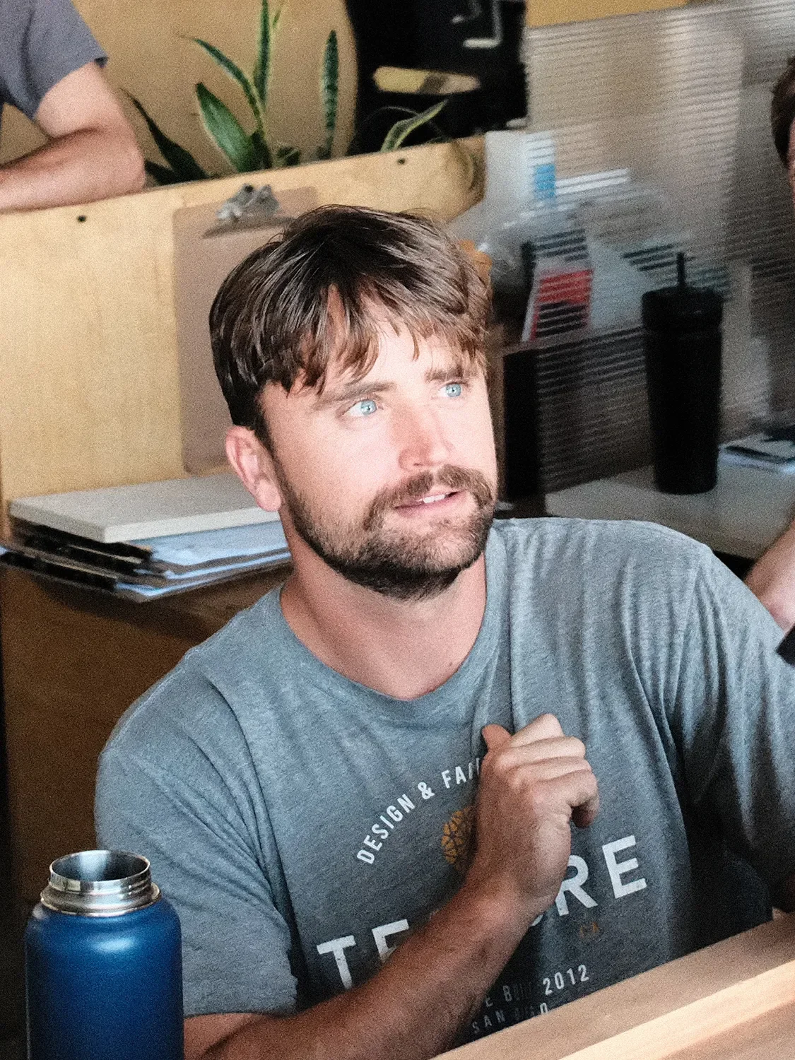 Ben Schmanke seated at his desk during a conversation in the Tecture office