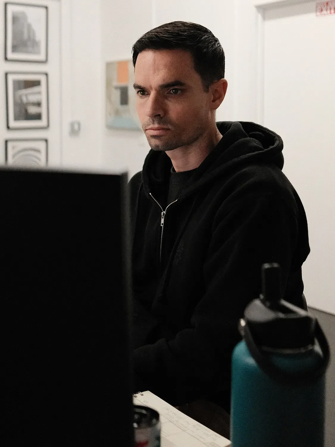 Luke Martin at his desk at Tecture focused on finalizing a project estimate for custom architectural features