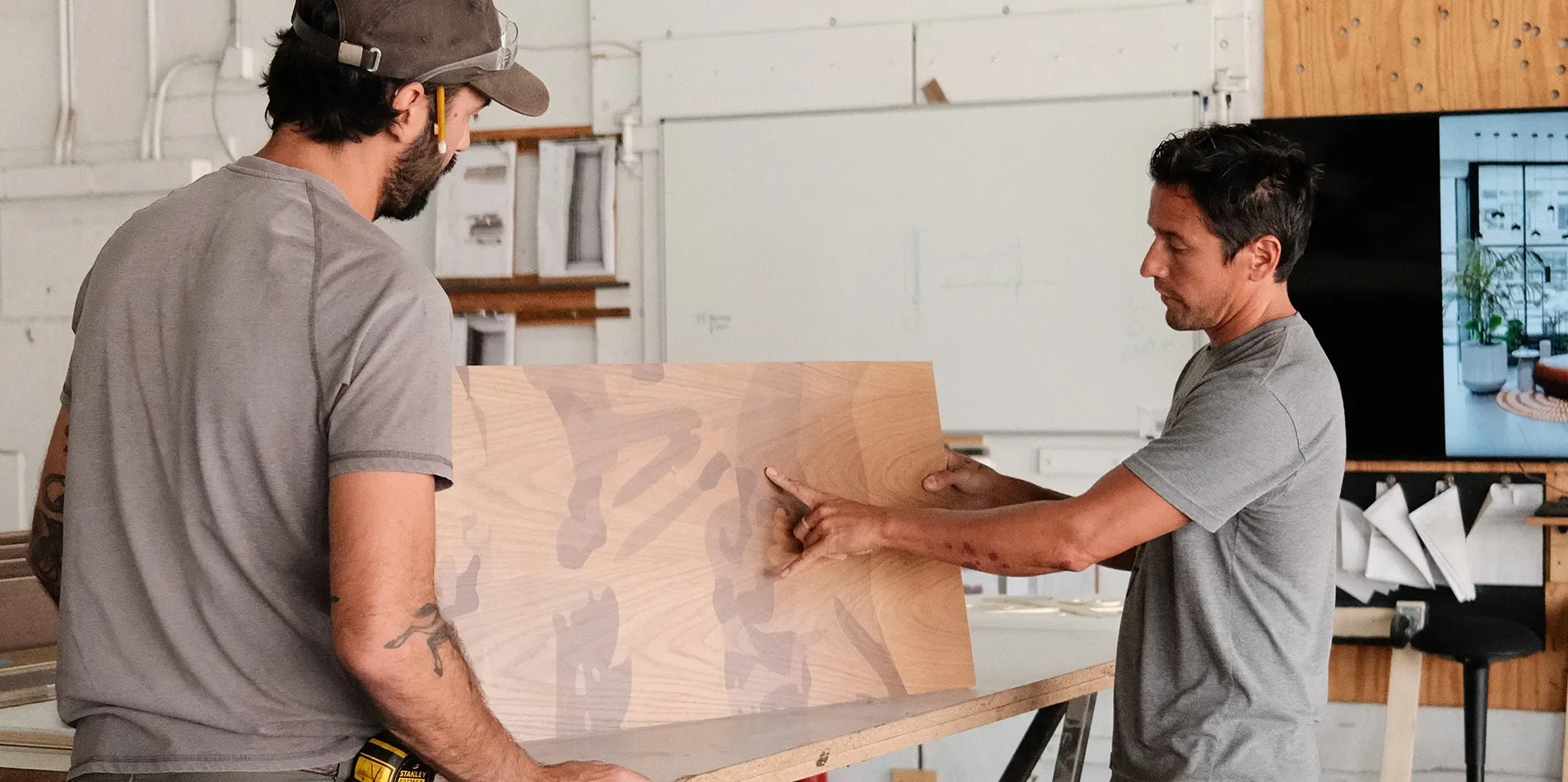 A Tecture AF Fabricator and Project Manager reviewing fabrication details for quality and accuracy