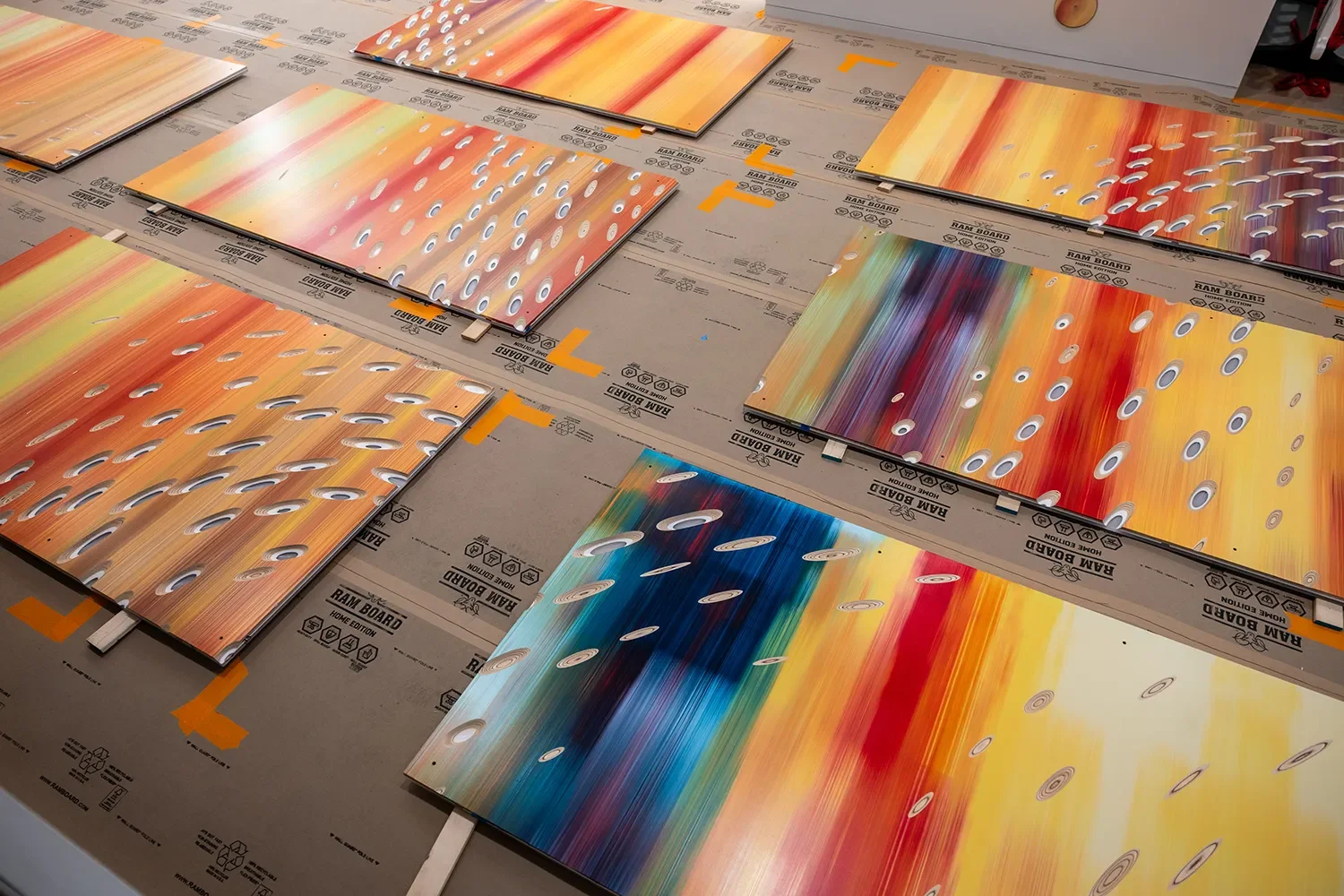 The finished hand painted and CNC scooped panels laid out on the floor before installation