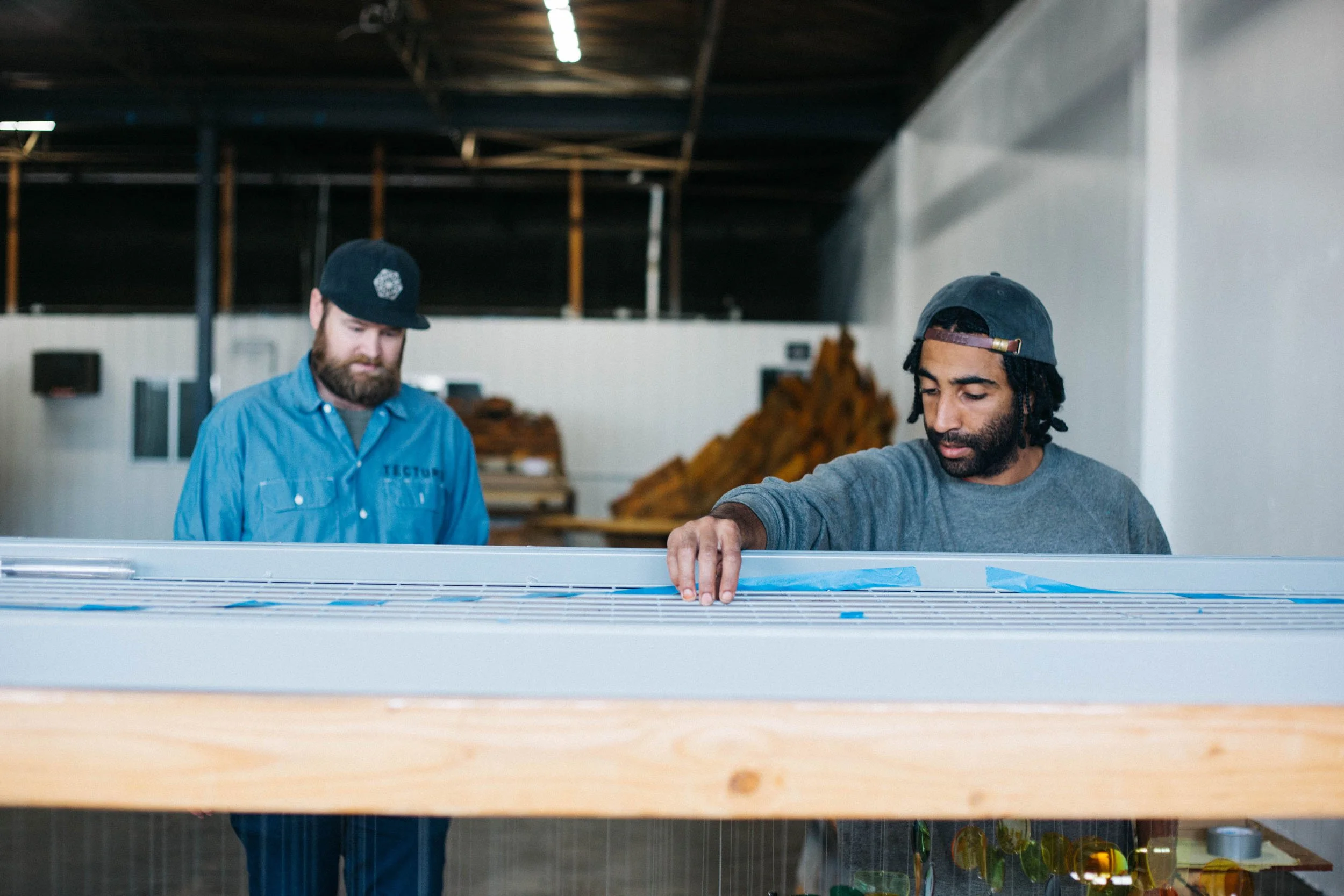 Tecture AF fabricators assembling a custom art feature for a corporate office EGD project.
