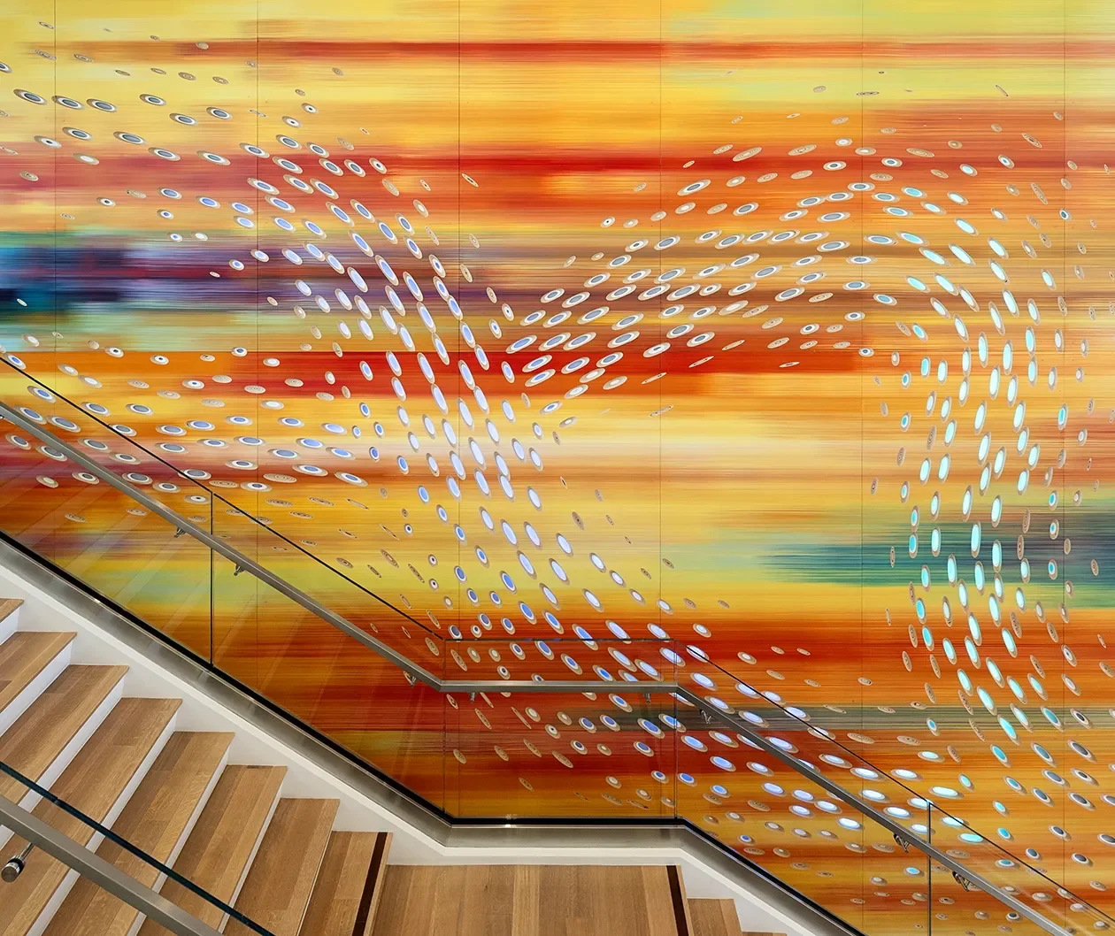 Convergence, a forty foot hand painted illuminated wall sculpture with integrated lighting in San Diego