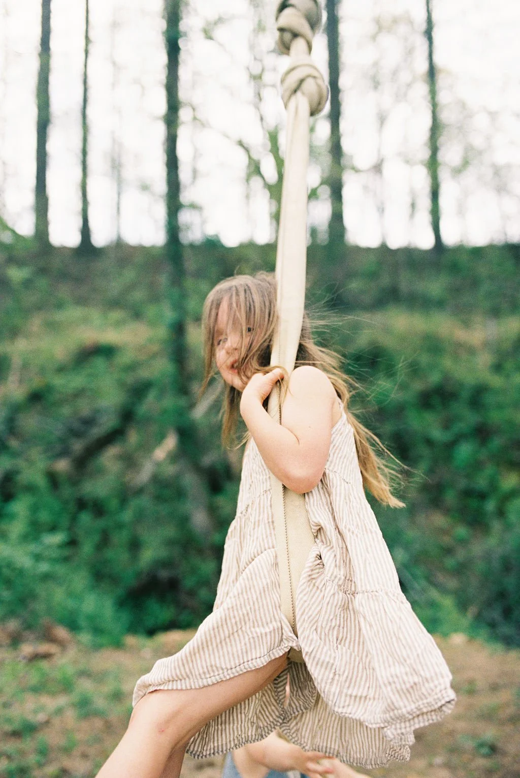 girl swinging outside