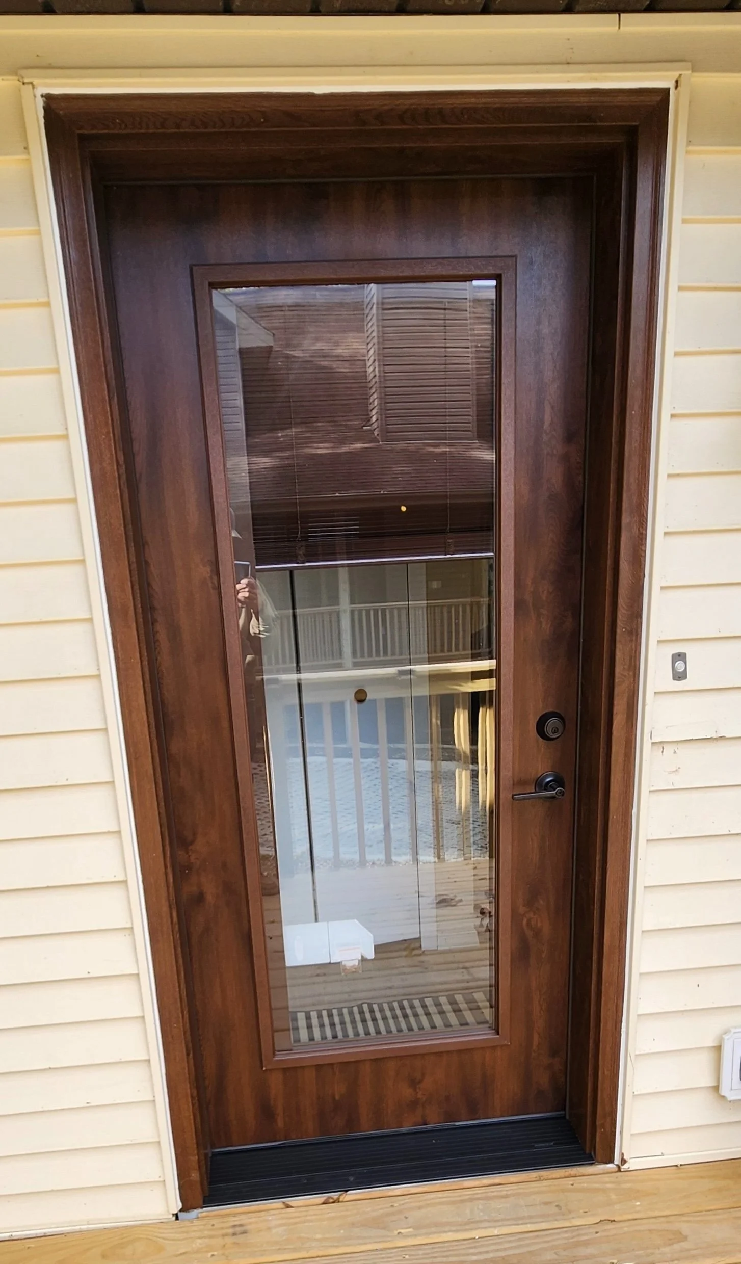 Wooden door with glass panel